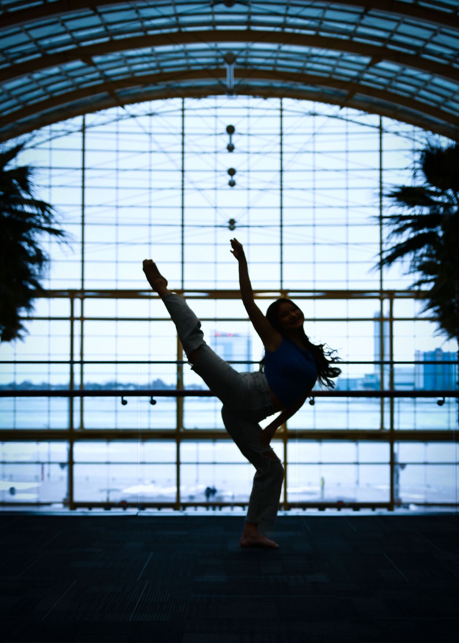 Artistic silhouette of a dancer posing in front of tall arched windows at 24sevenDetroit
GM renaissance center
Detroit Northville Michigan