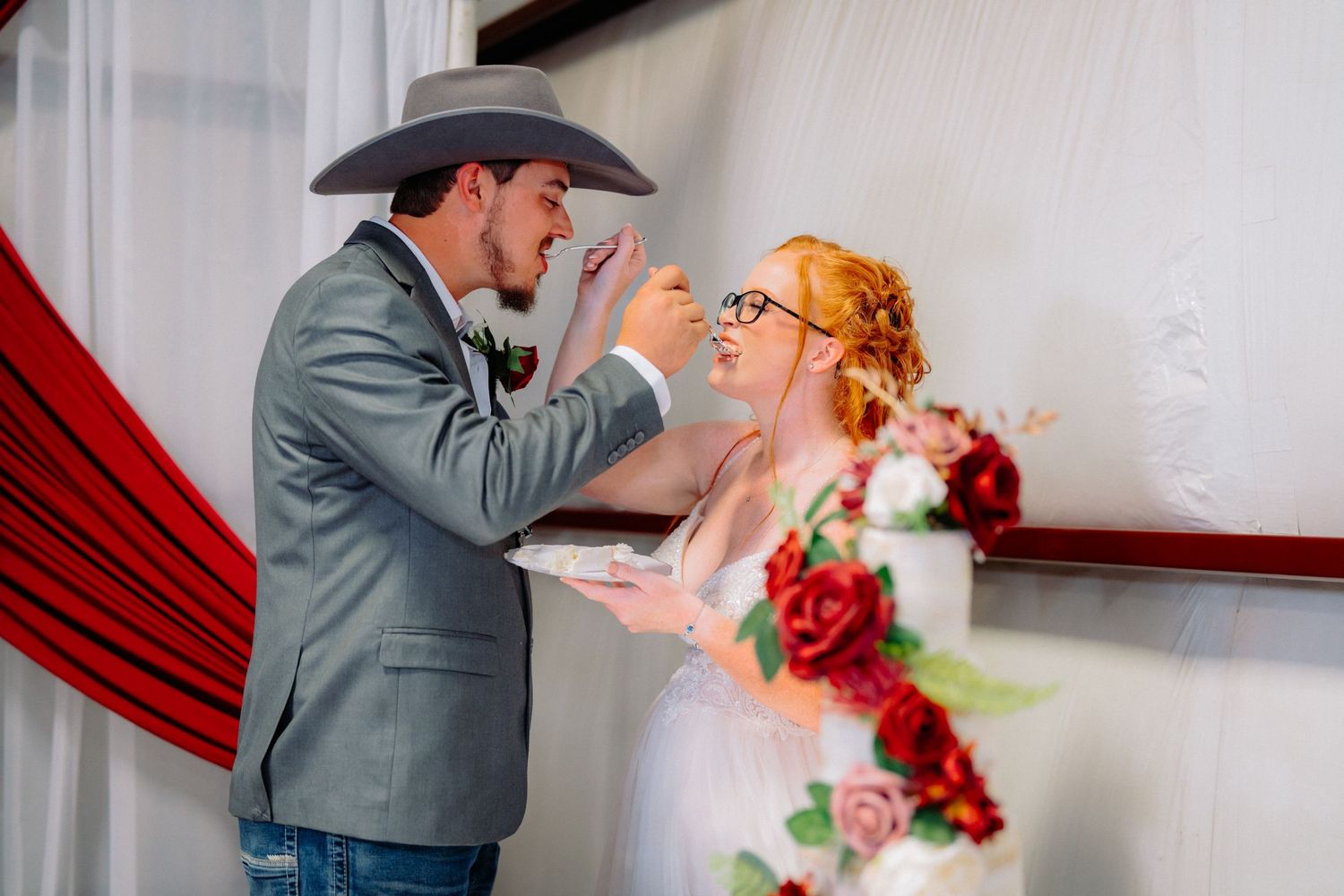 Special moment during wedding ceremony with couple in western attire.