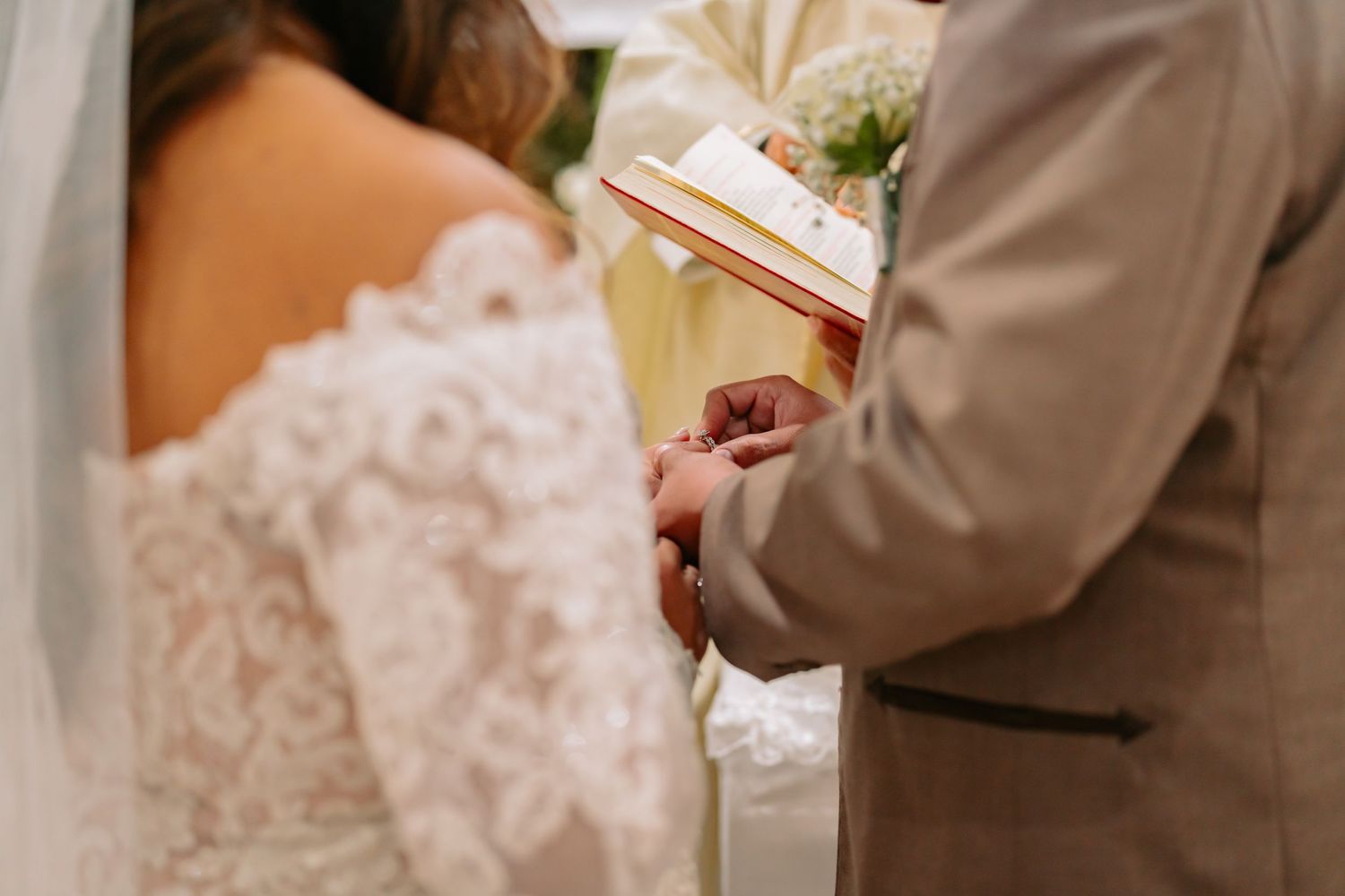 Wedding ceremony details with classic decor and floral arrangements.