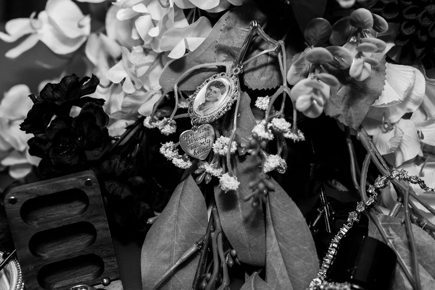 Elegant floral arrangements with roses and greenery in monochrome.