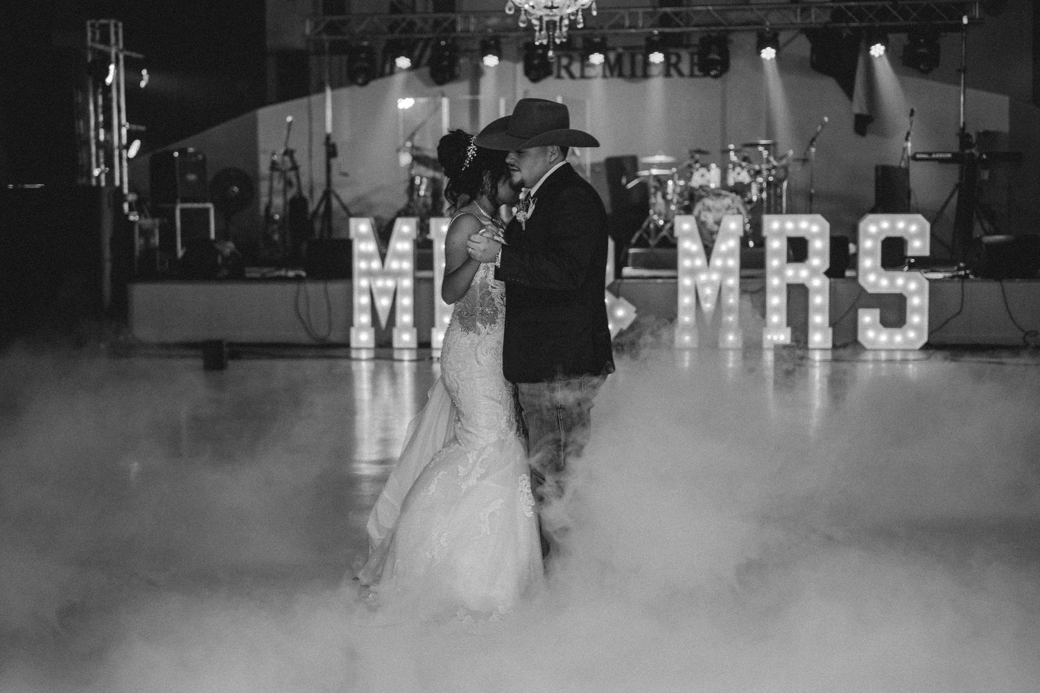 Black and white wedding reception photos showing silhouettes dancing in a decorated venue.