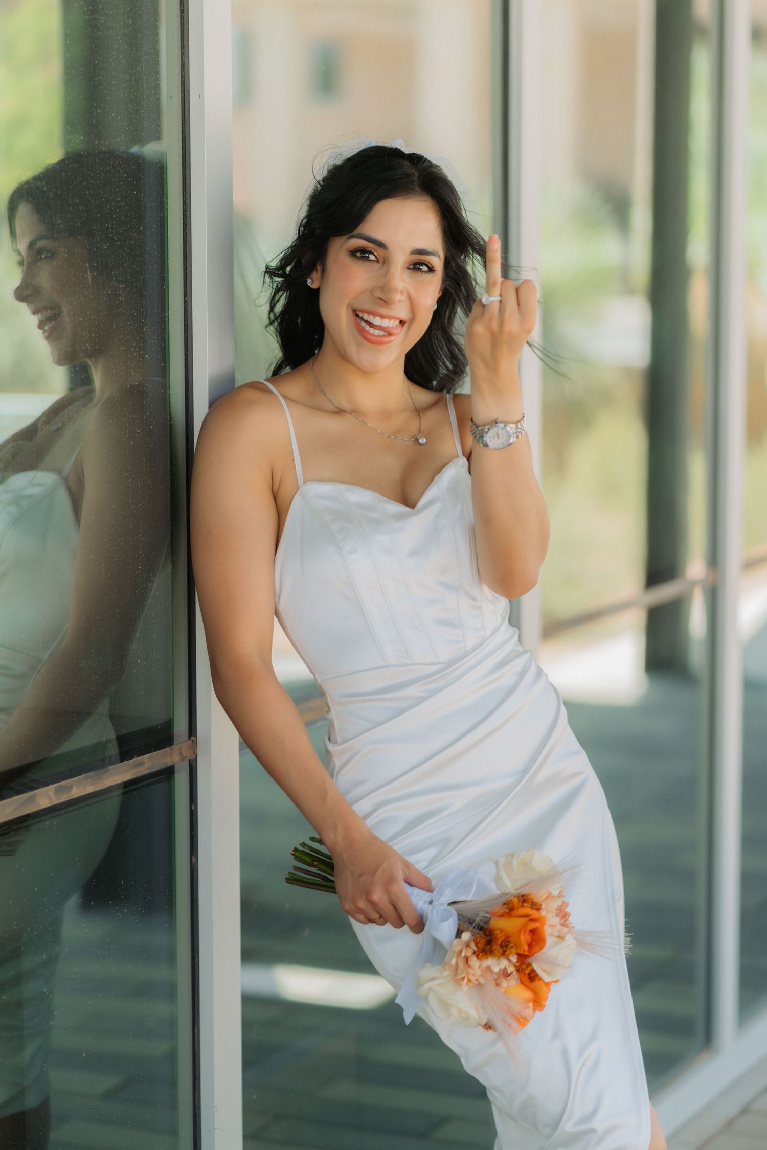A bride celebrates her wedding showing off her bouquet and ring in Midland Texas