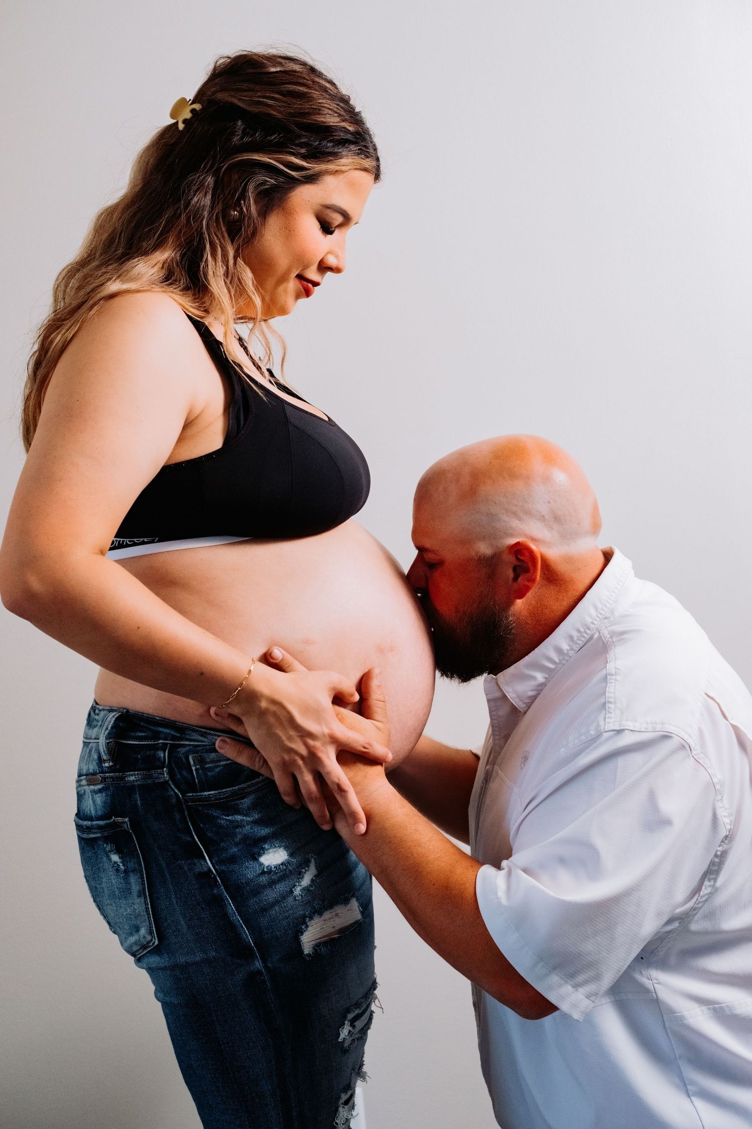 An emotional maternity photography sequence showing tender moments between expecting parents.