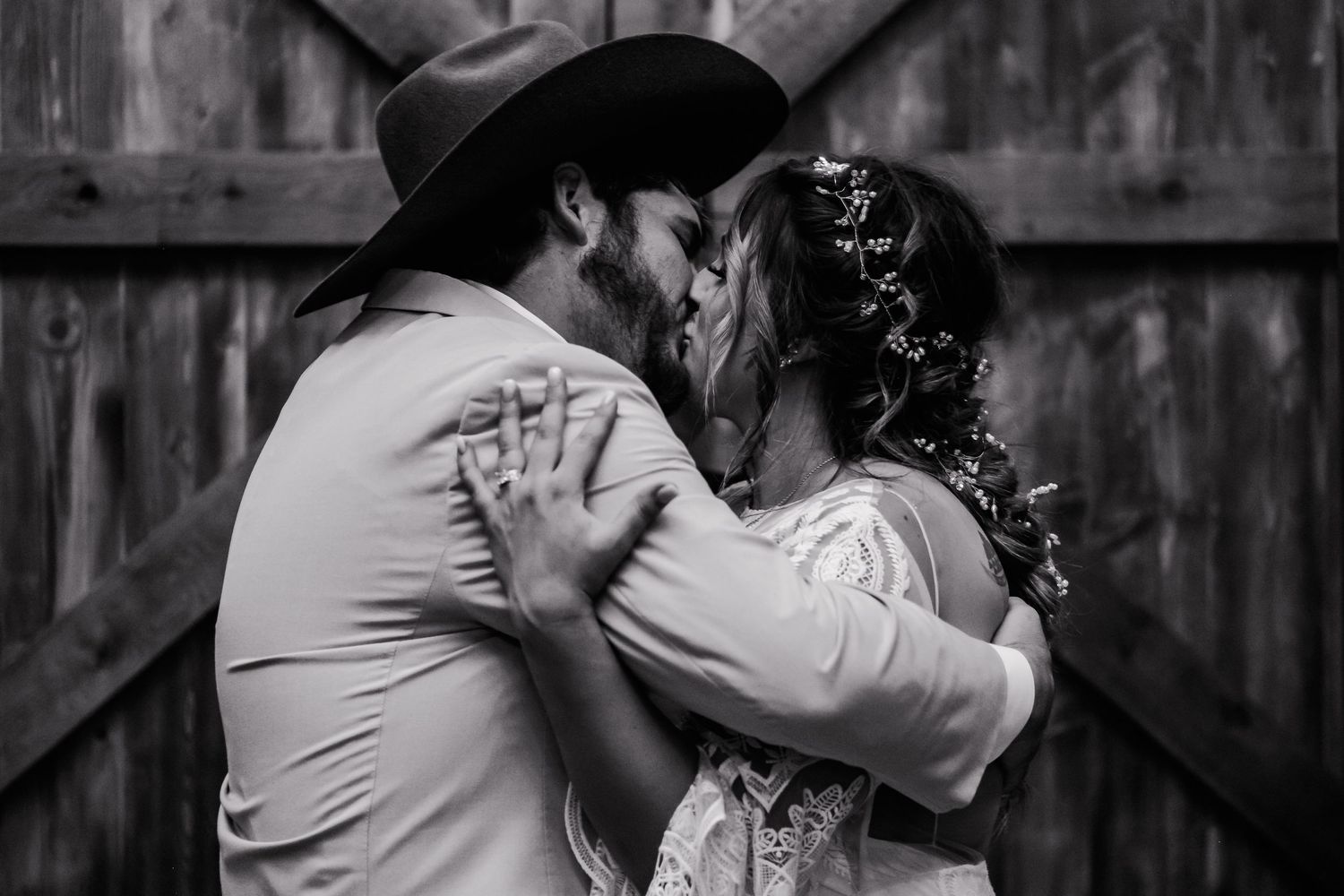Black and white portrait of western wedding couple sharing intimate moment.