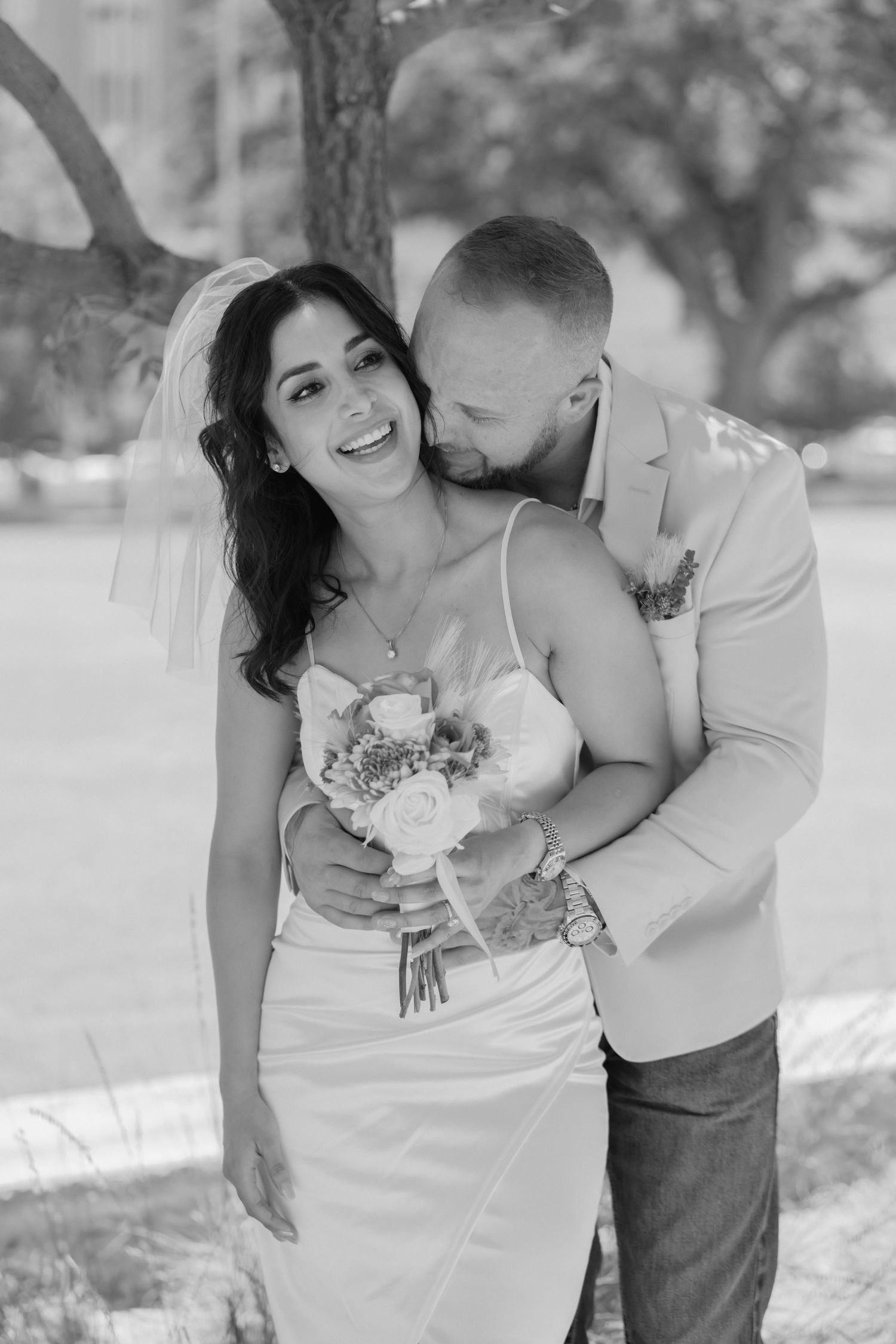 A romantic wedding photoshoot series shows tender moments between newlyweds in a natural outdoor setting.