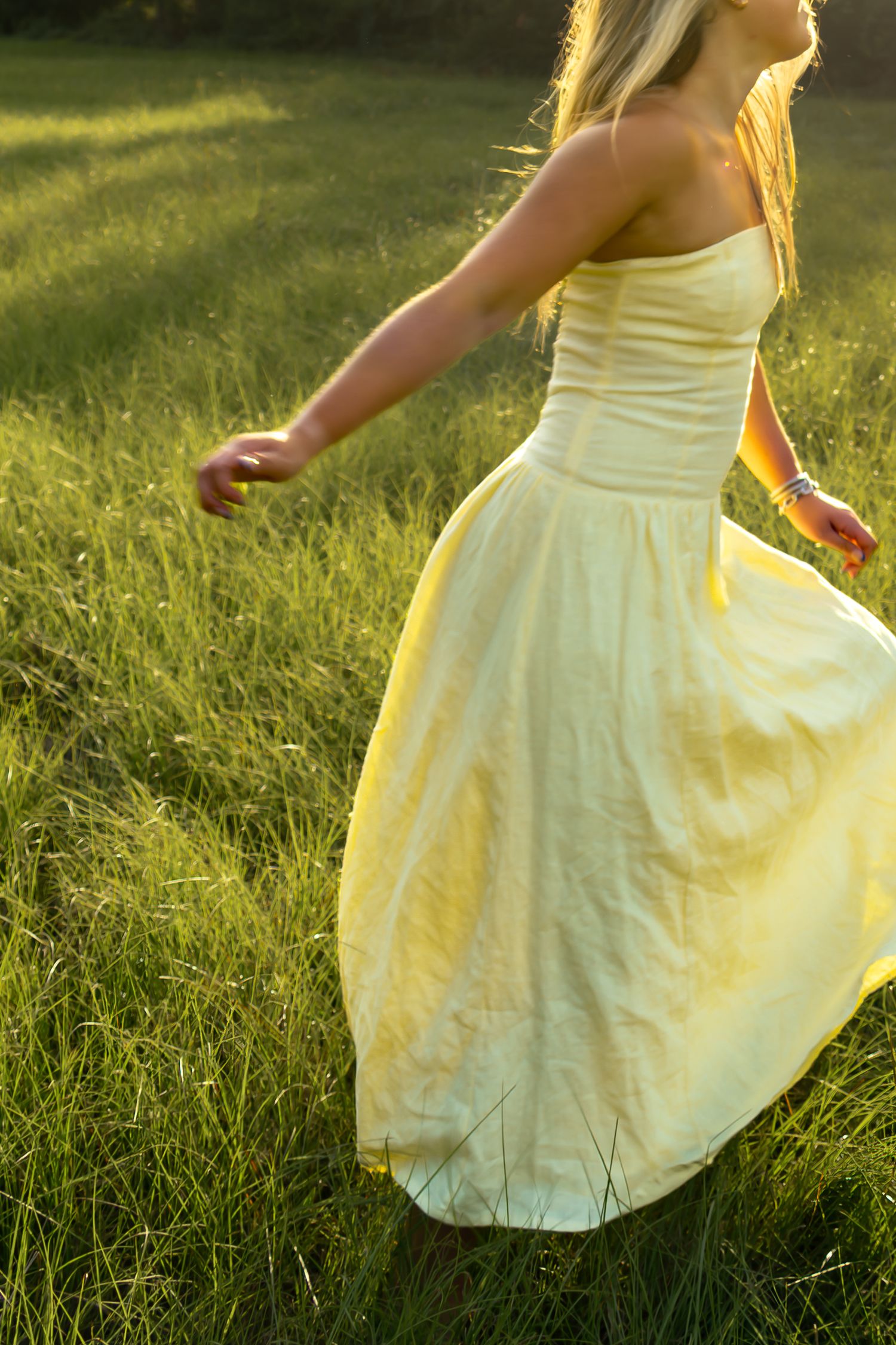 Candid shot of a girl laughing mid-step.