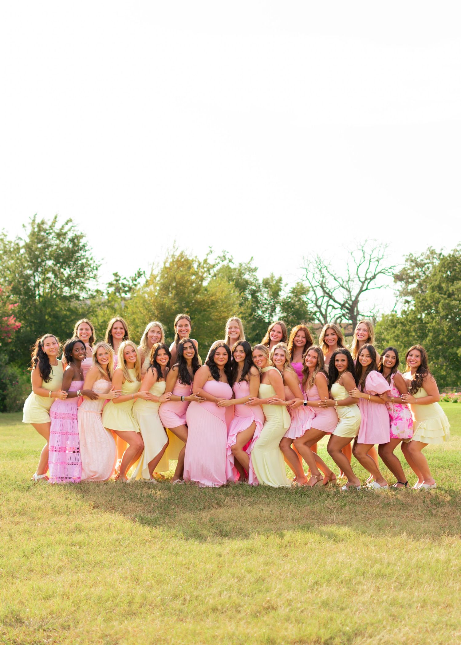Group photo of an organizational event in a field.