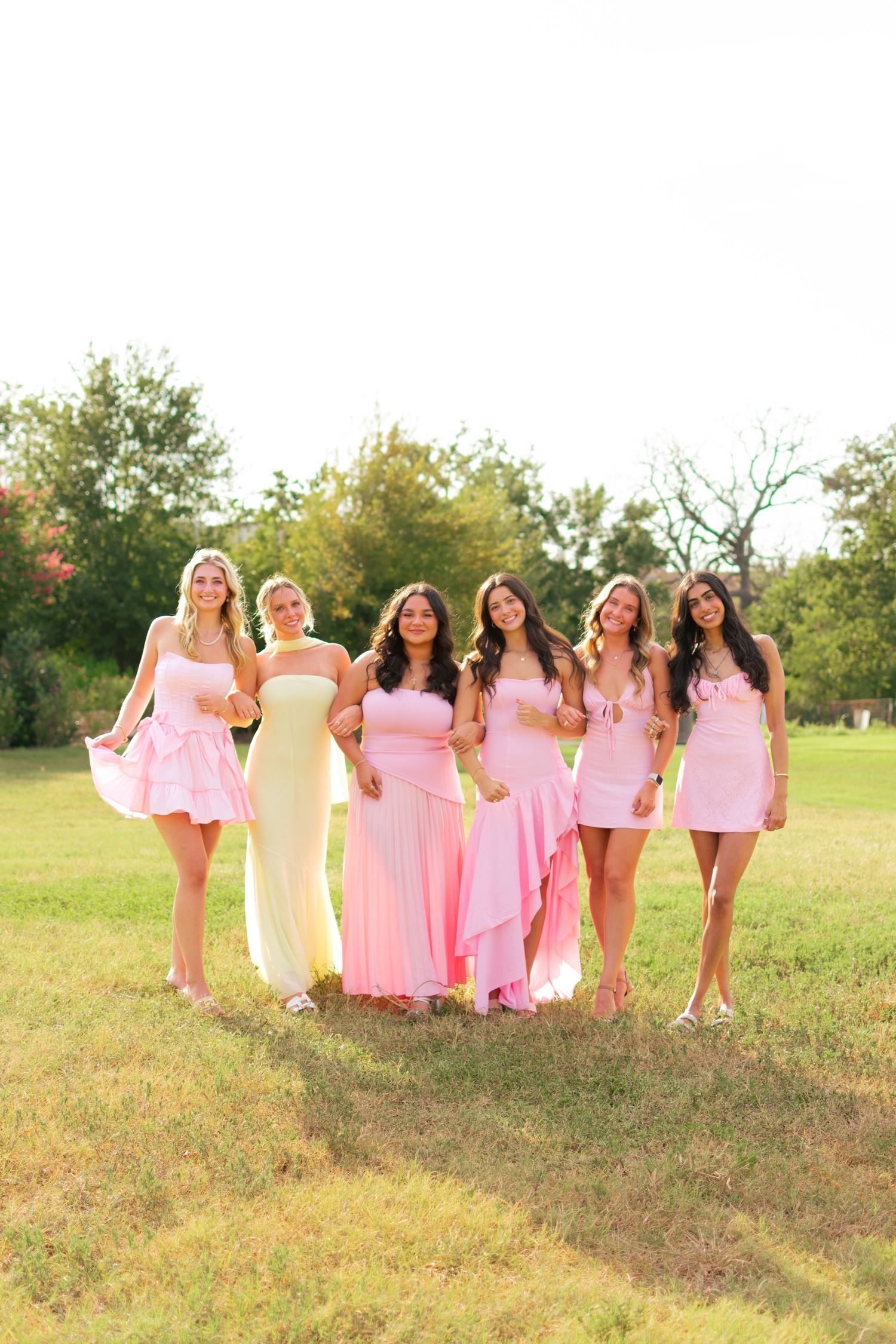 Group photo of an organizational event in a field.