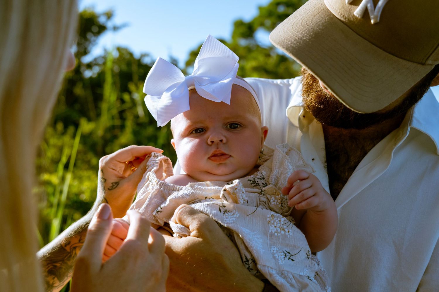 A lifestyle family photoshoot outdoors with natural lighting.
