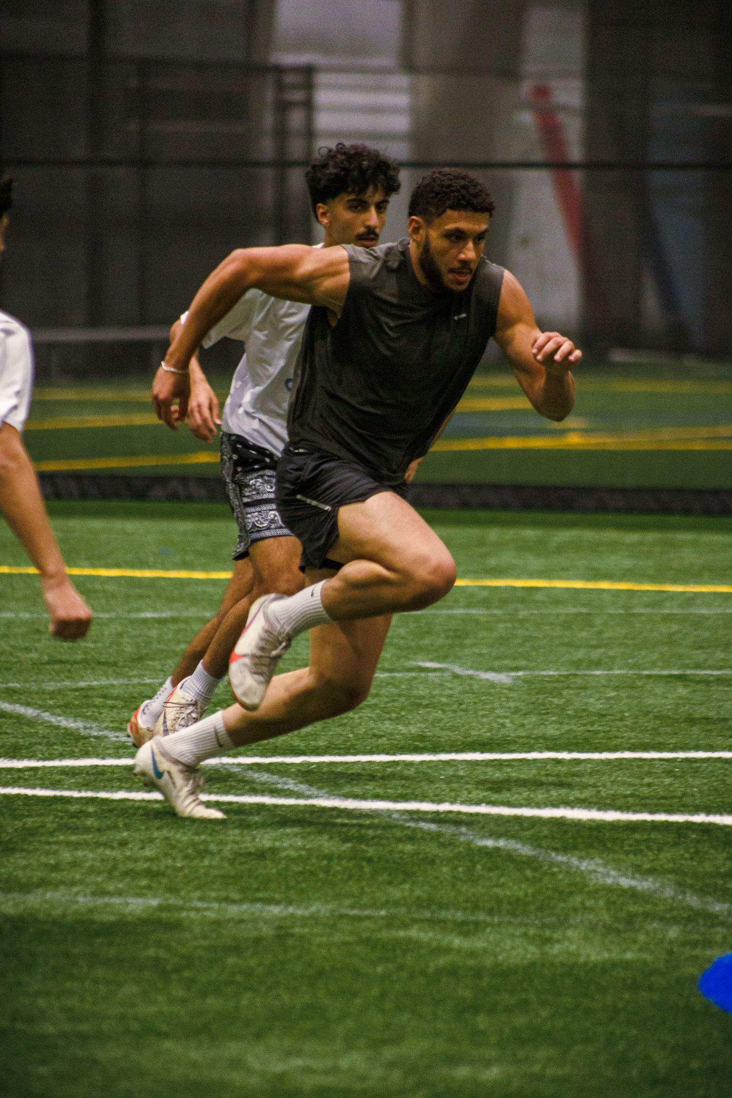 Athlete sprinting on indoor turf during a Minneapolis sports session