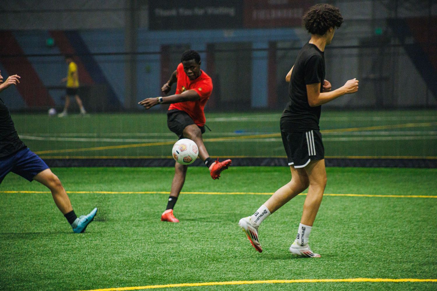 Indoor soccer match underway at a Minneapolis sports facility