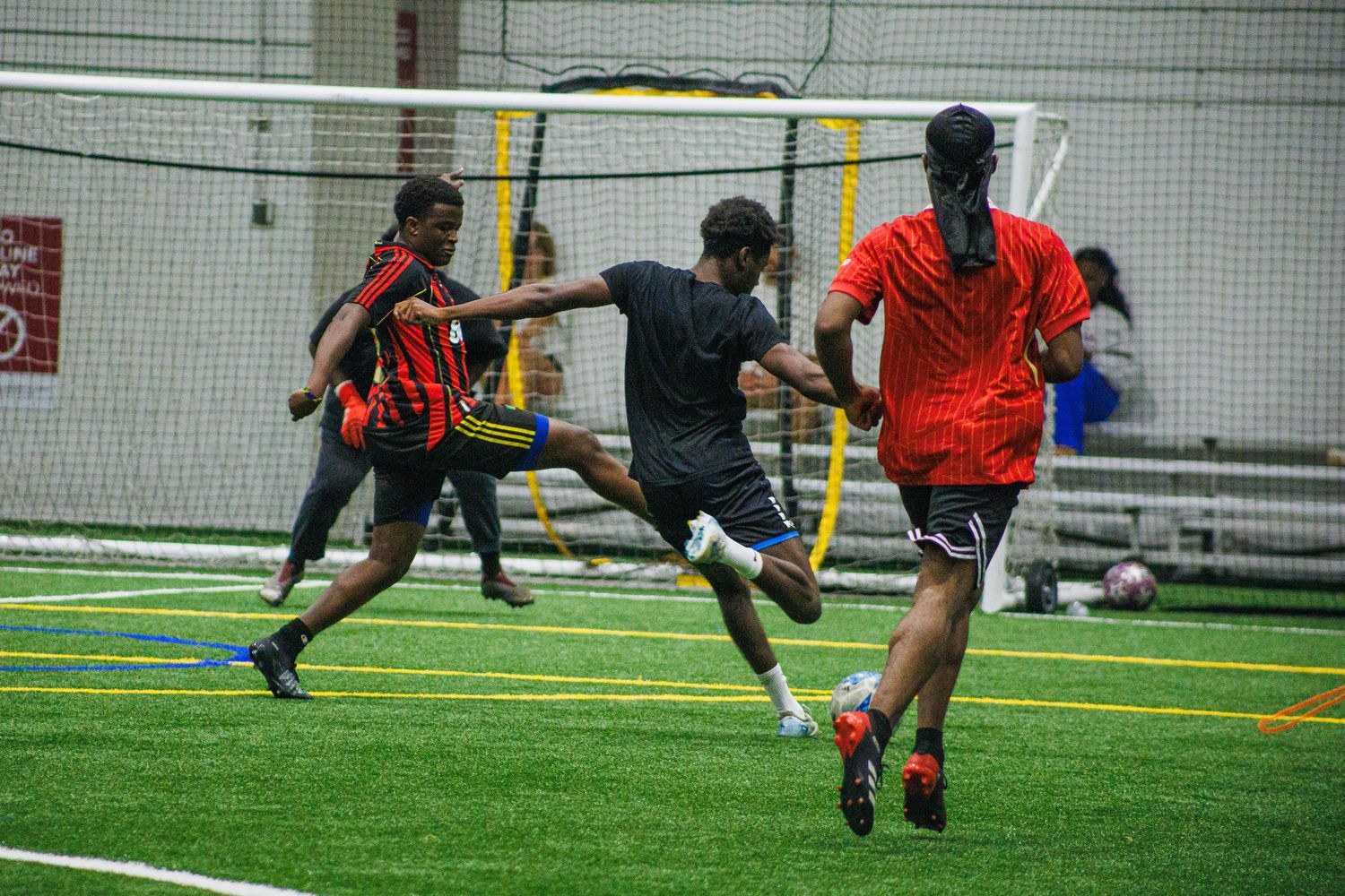 Goalmouth action during an indoor Twin Cities soccer league match