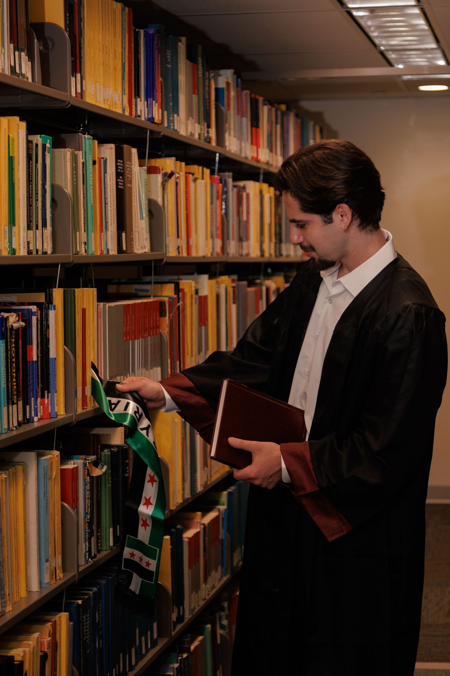 Graduation portrait of student taken at the University of Minnesota Twin Cities - photo in library.