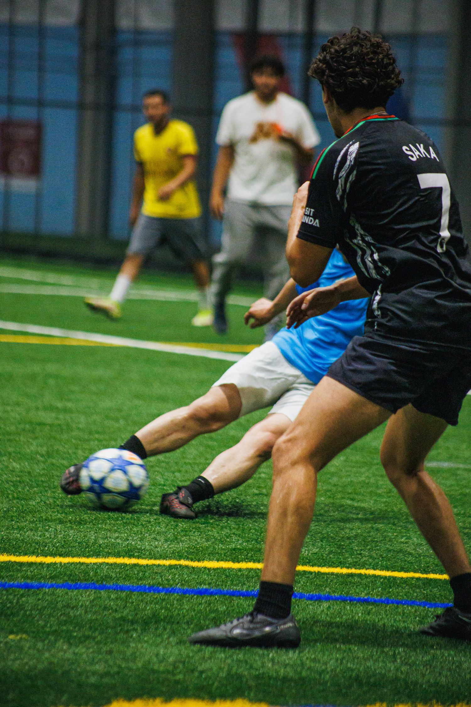 Player settling the ball during an indoor Minneapolis soccer match
