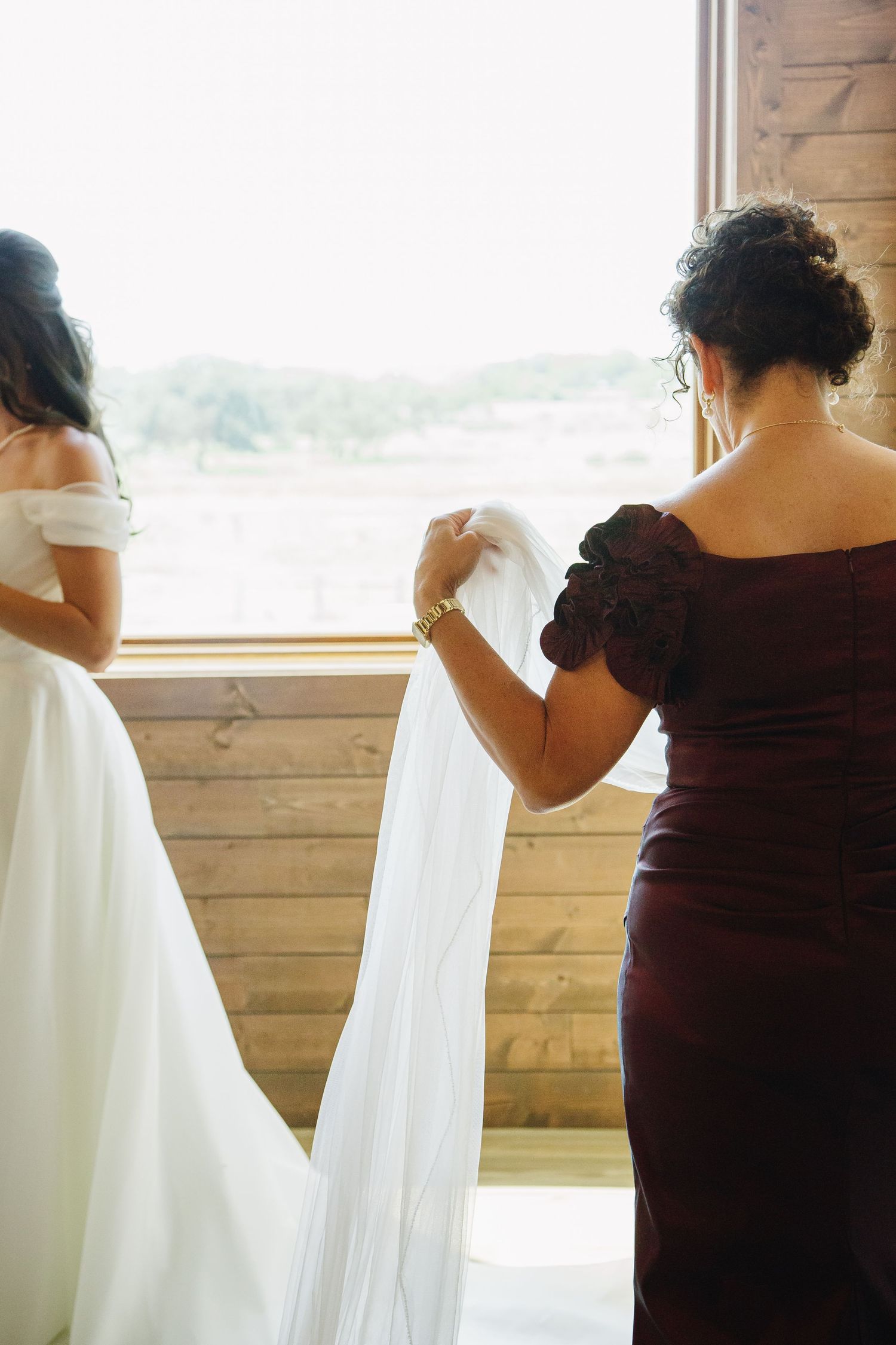 Bride being prepared for wedding ceremony