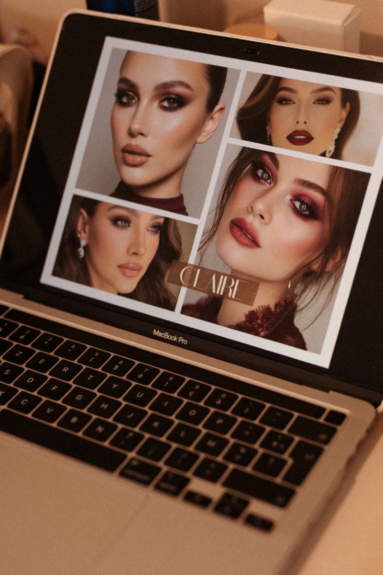 MacBook Pro displaying a makeup artist portfolio named Claire featuring four glamorous beauty looks with bold eye makeup.