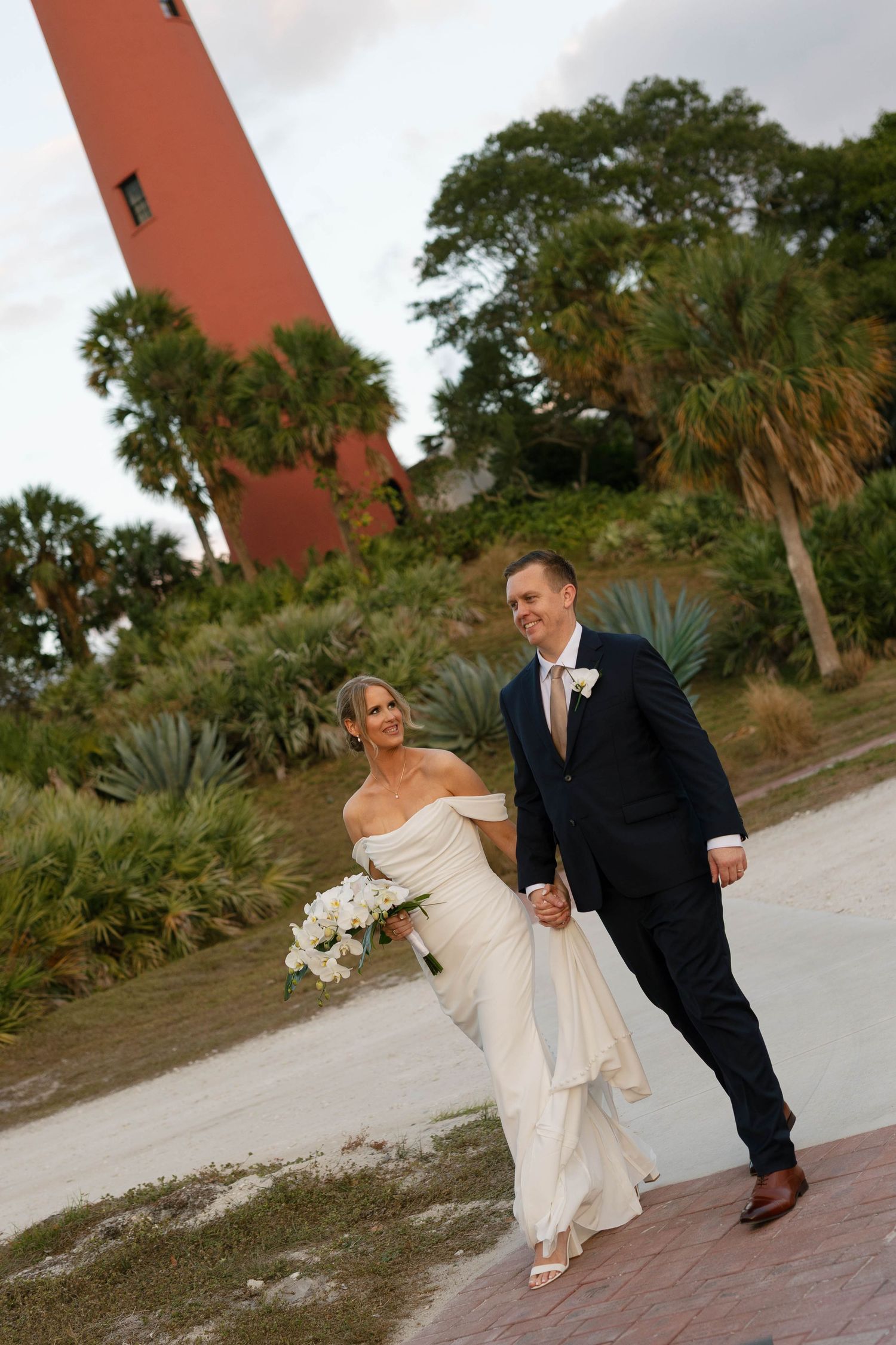 Romantic Jupiter, Florida wedding ceremony surrounded by tropical banyan trees at the historic Jupiter Inlet Lighthouse