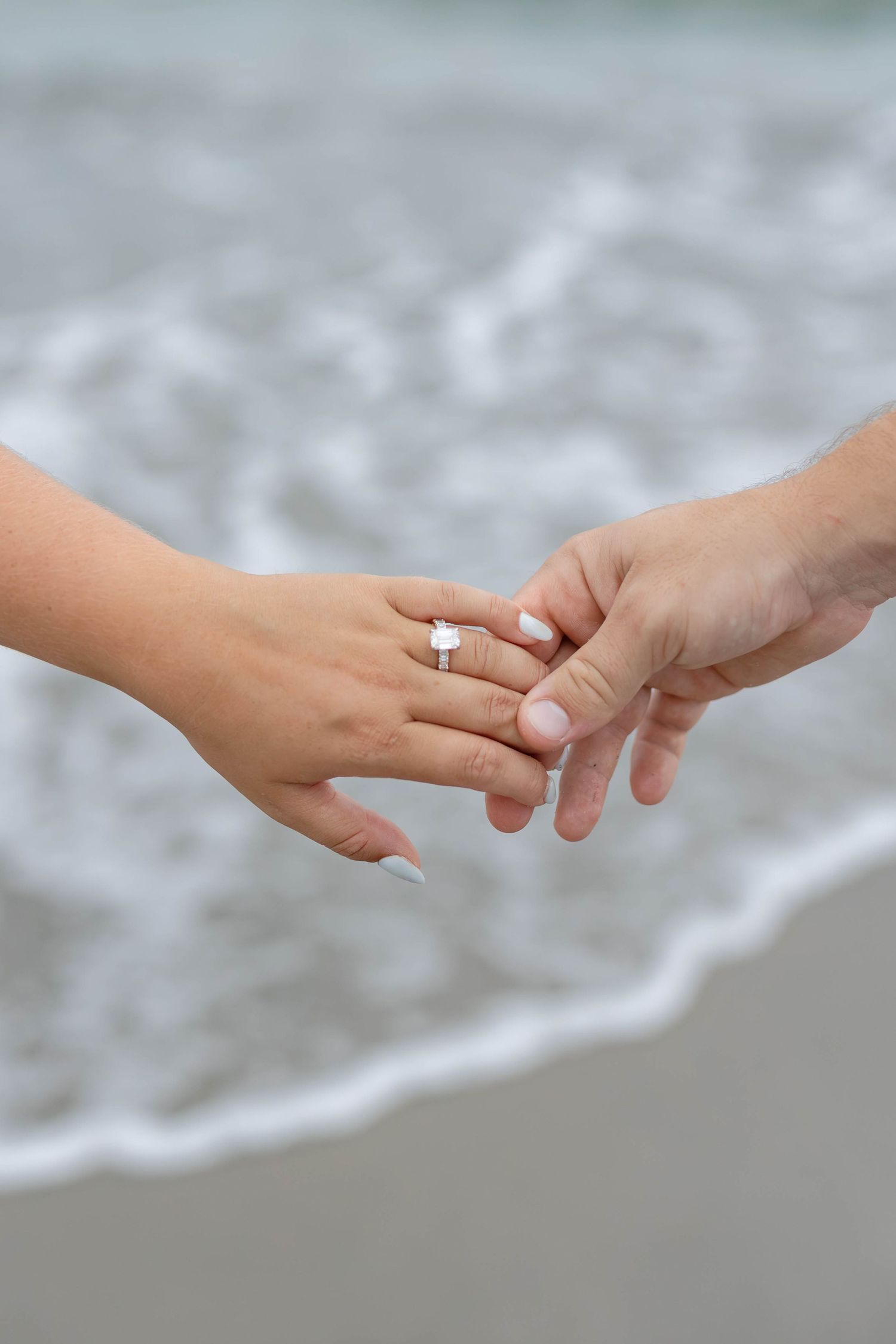 Romantic oceanfront engagement photos of Elliot and Annabel on Palm Beach Island, captured by Daniella Dyan Photography.