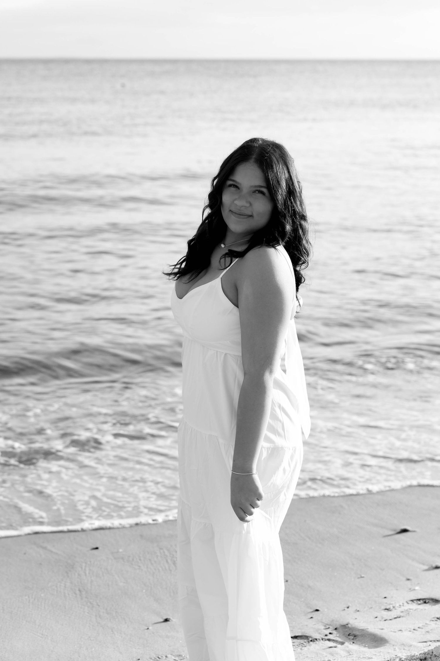 Senior photos at Harkness Memorial State Park featuring elegant garden pathways in Connecticut. Timeless natural senior photographer