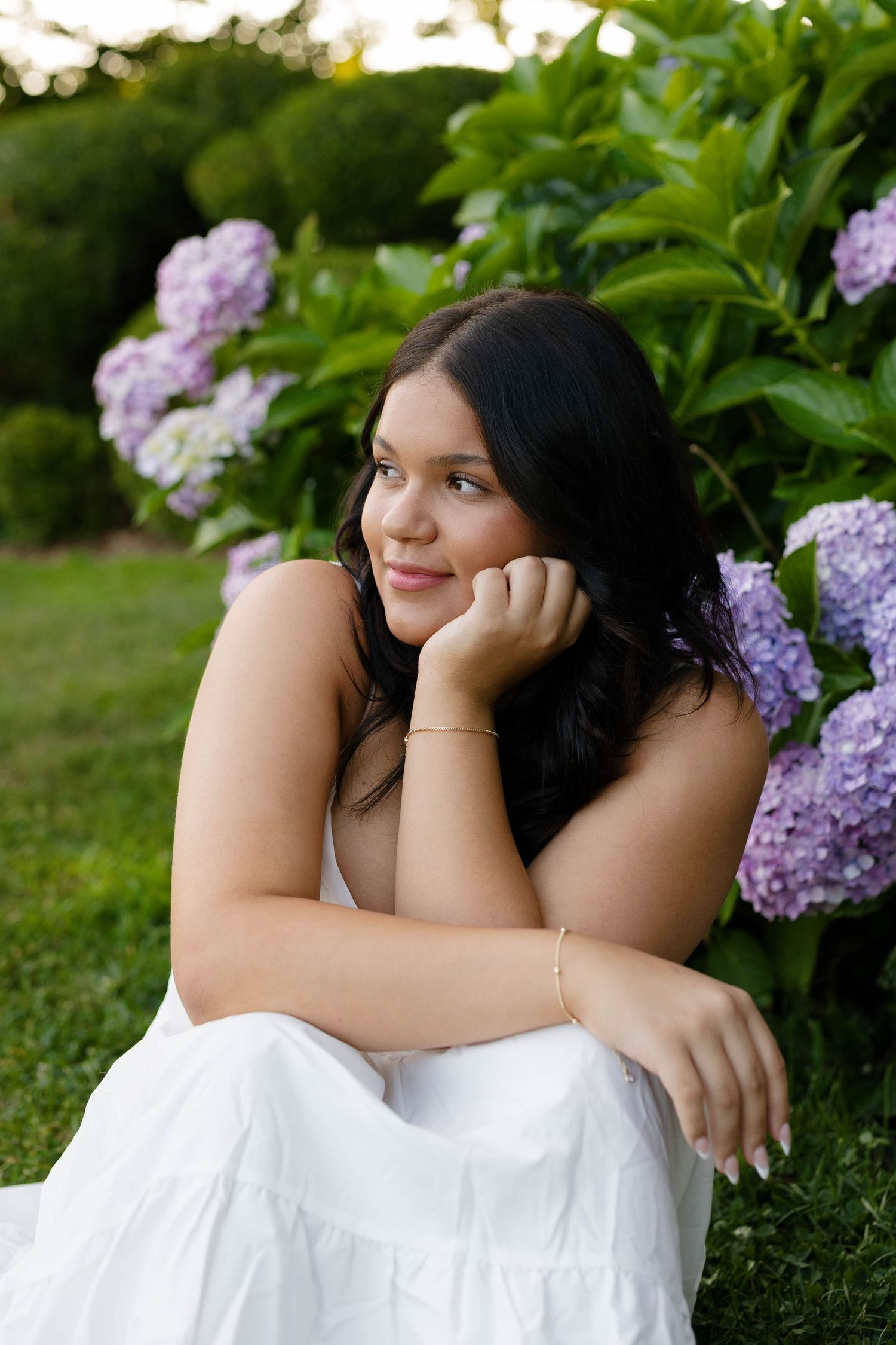 Senior photos at Harkness Memorial State Park featuring elegant garden pathways in Connecticut