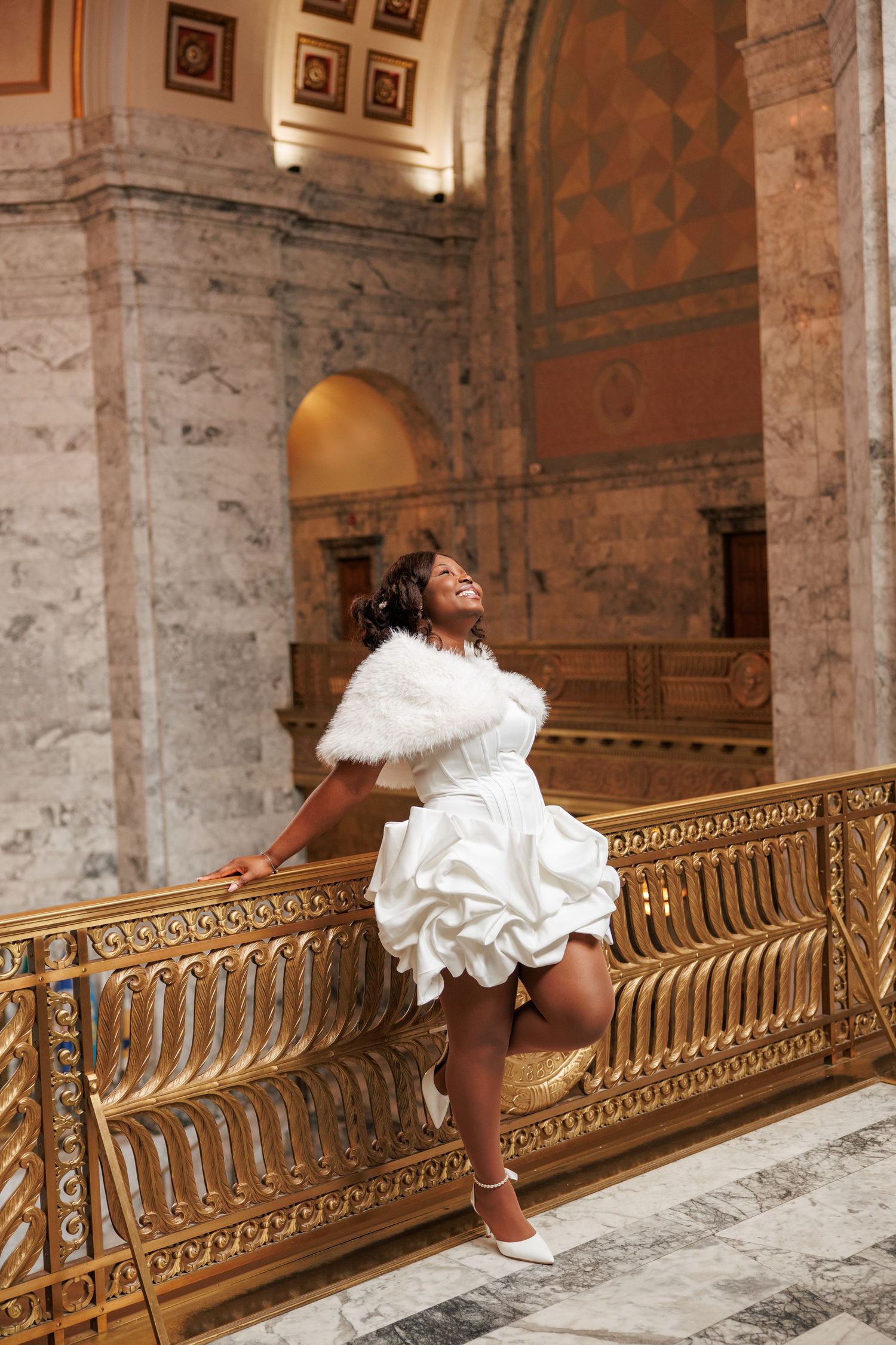 Playful bridal portrait inside the Washington State Capitol during an Olympia wedding