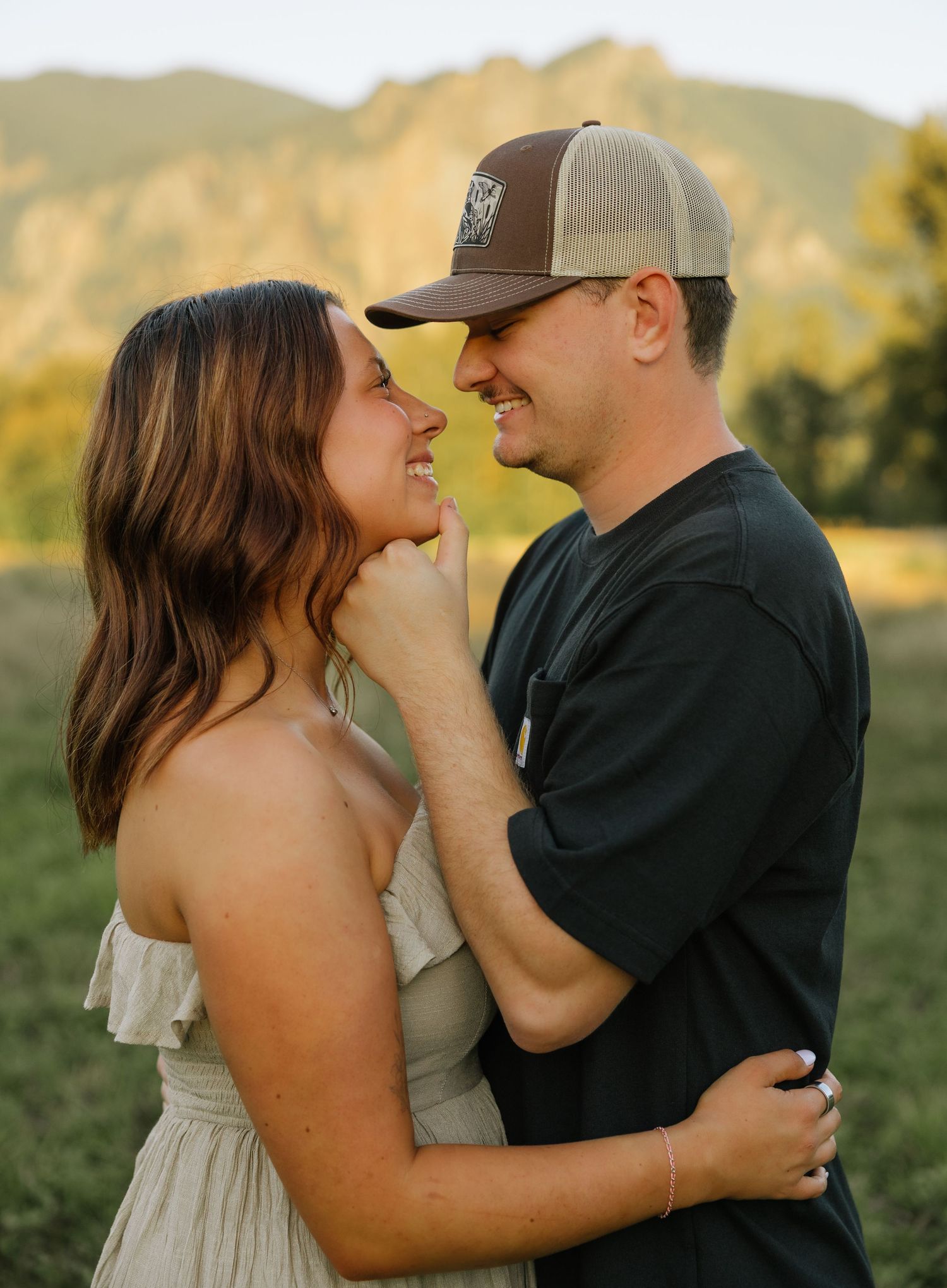 Candid couple portrait with scenic mountain views during an outdoor couples session in Washington.