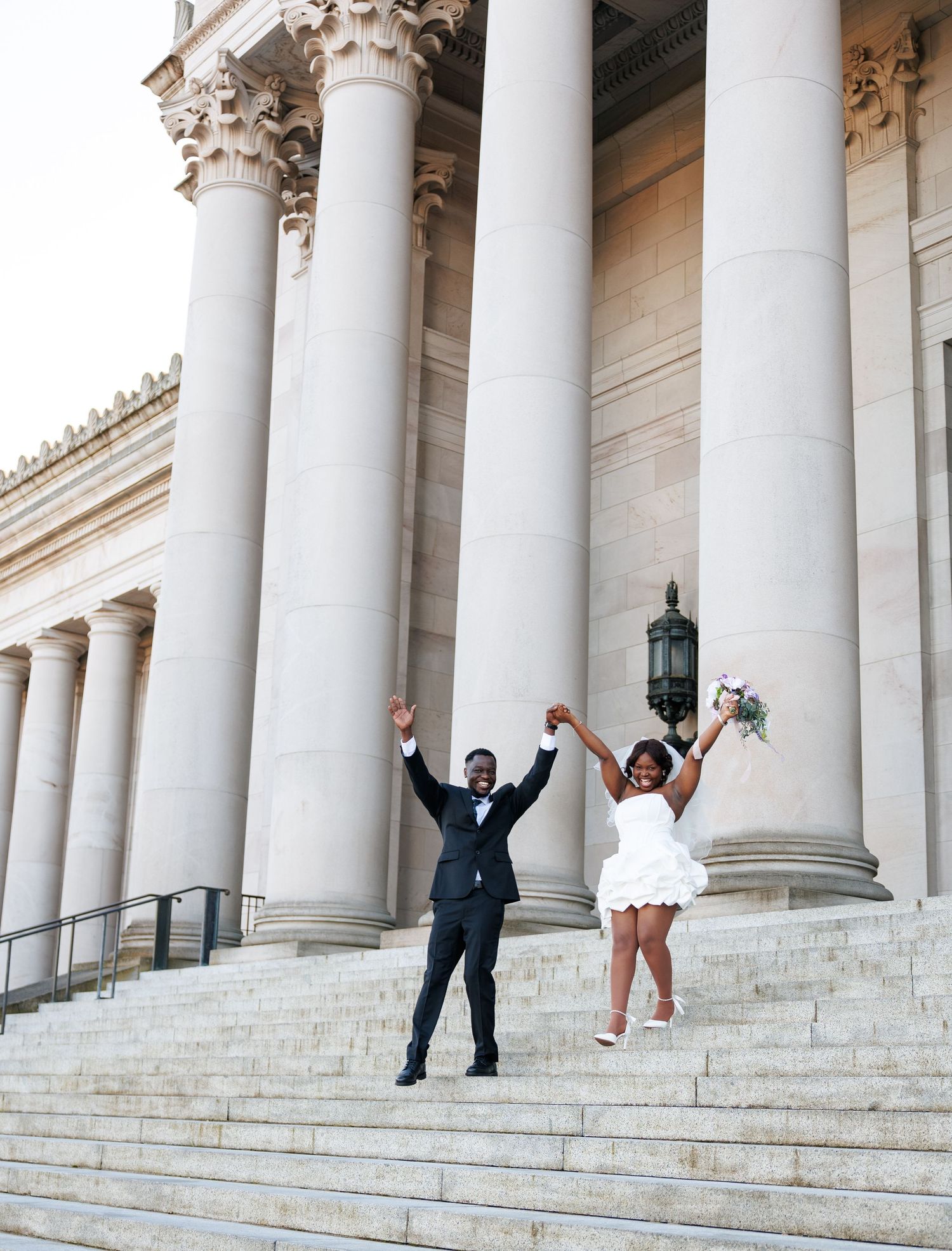 Newlyweds celebrating together on the Washington State Capitol steps in Olympia