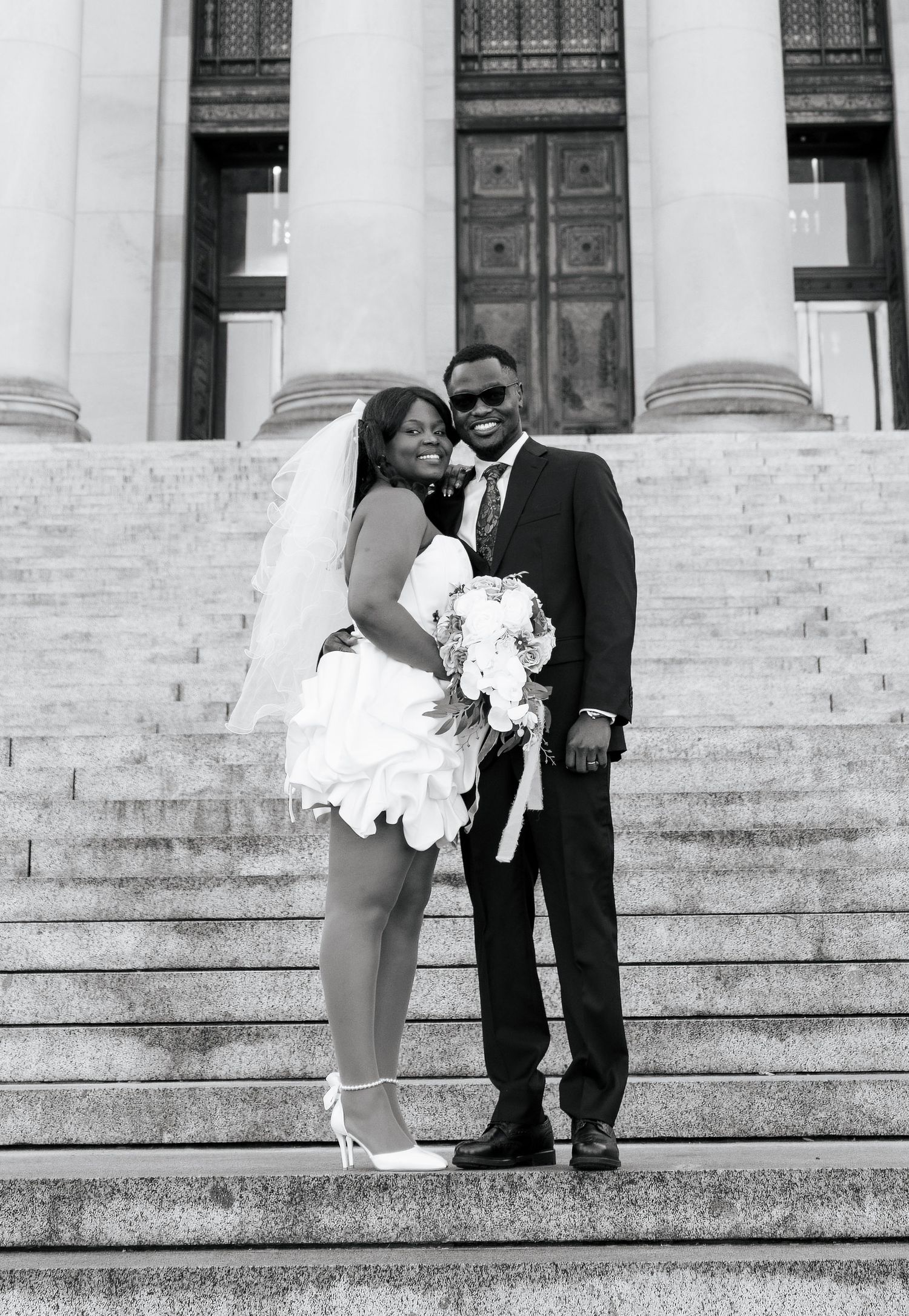 Bride and groom on the Washington State Capitol steps in Olympia