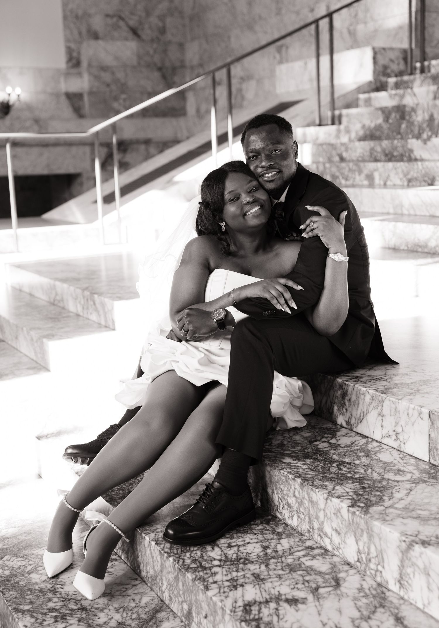 Bride and groom sitting together on the Washington State Capitol steps in Olympia