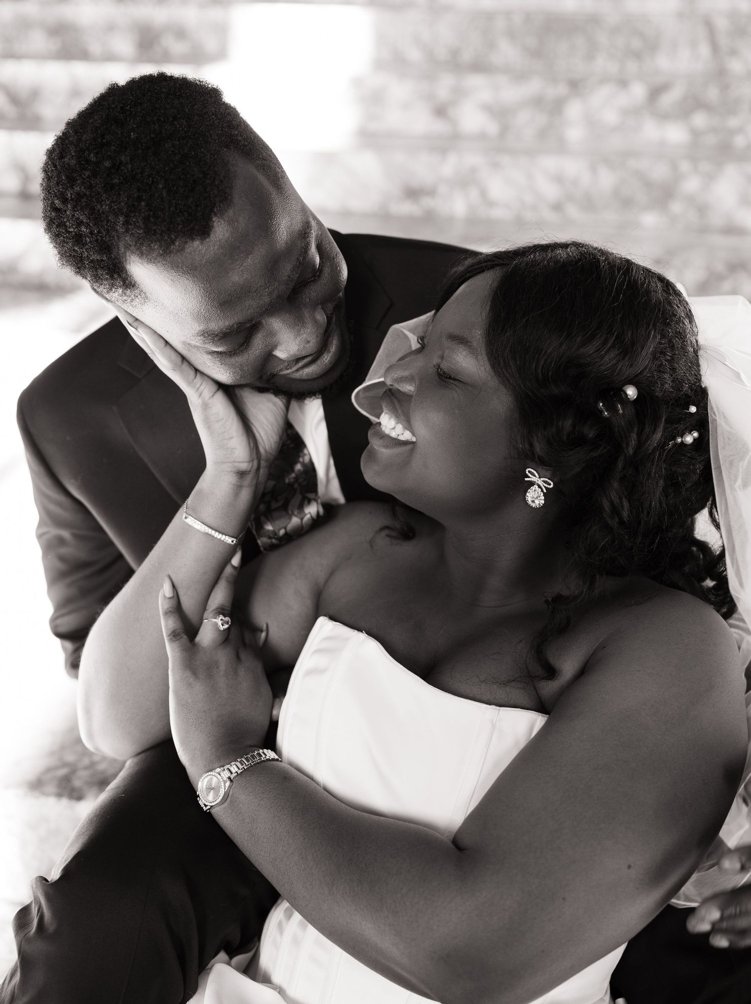 Candid black and white portrait of newlyweds laughing together at their Olympia wedding