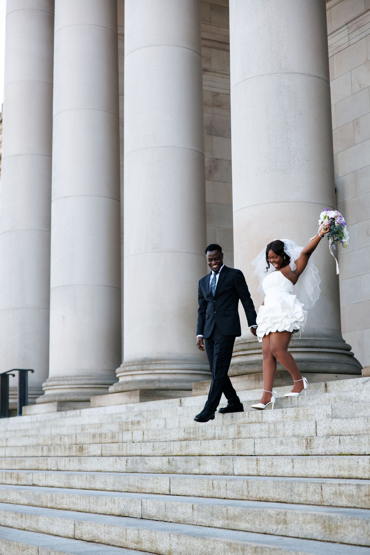 Newlyweds celebrating together on the Washington State Capitol steps in Olympia