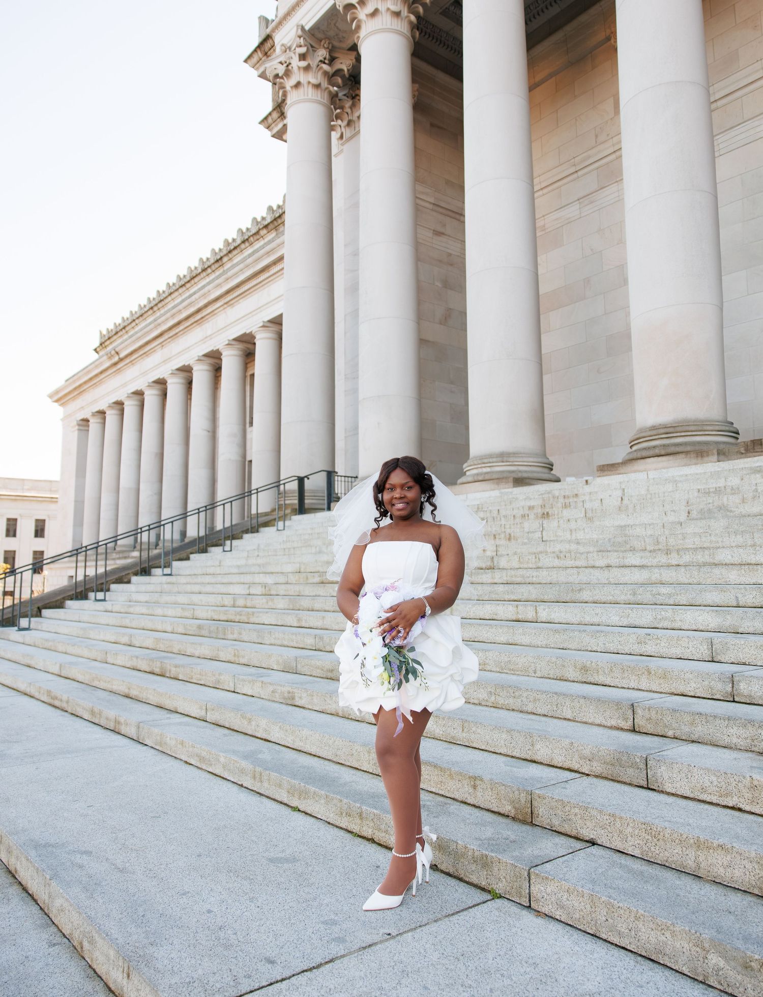 Bride posing with her bouquet outside the Washington State Capitol in Olympia