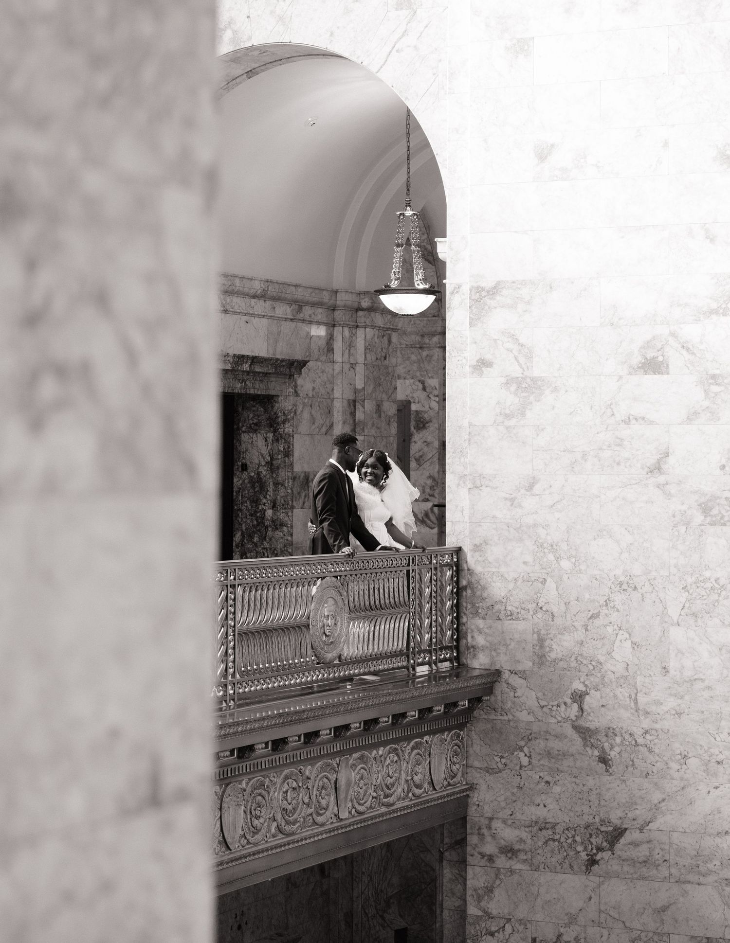 Artistic black and white wedding portrait framed by the architecture of the Washington State Capitol
