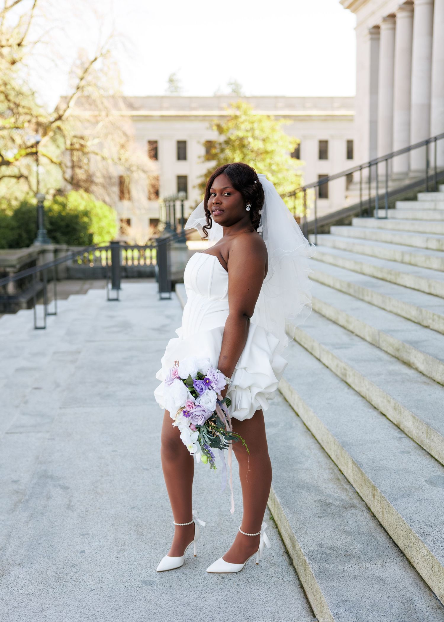 Bridal portrait with colorful bouquet on the Washington State Capitol steps in Olympia