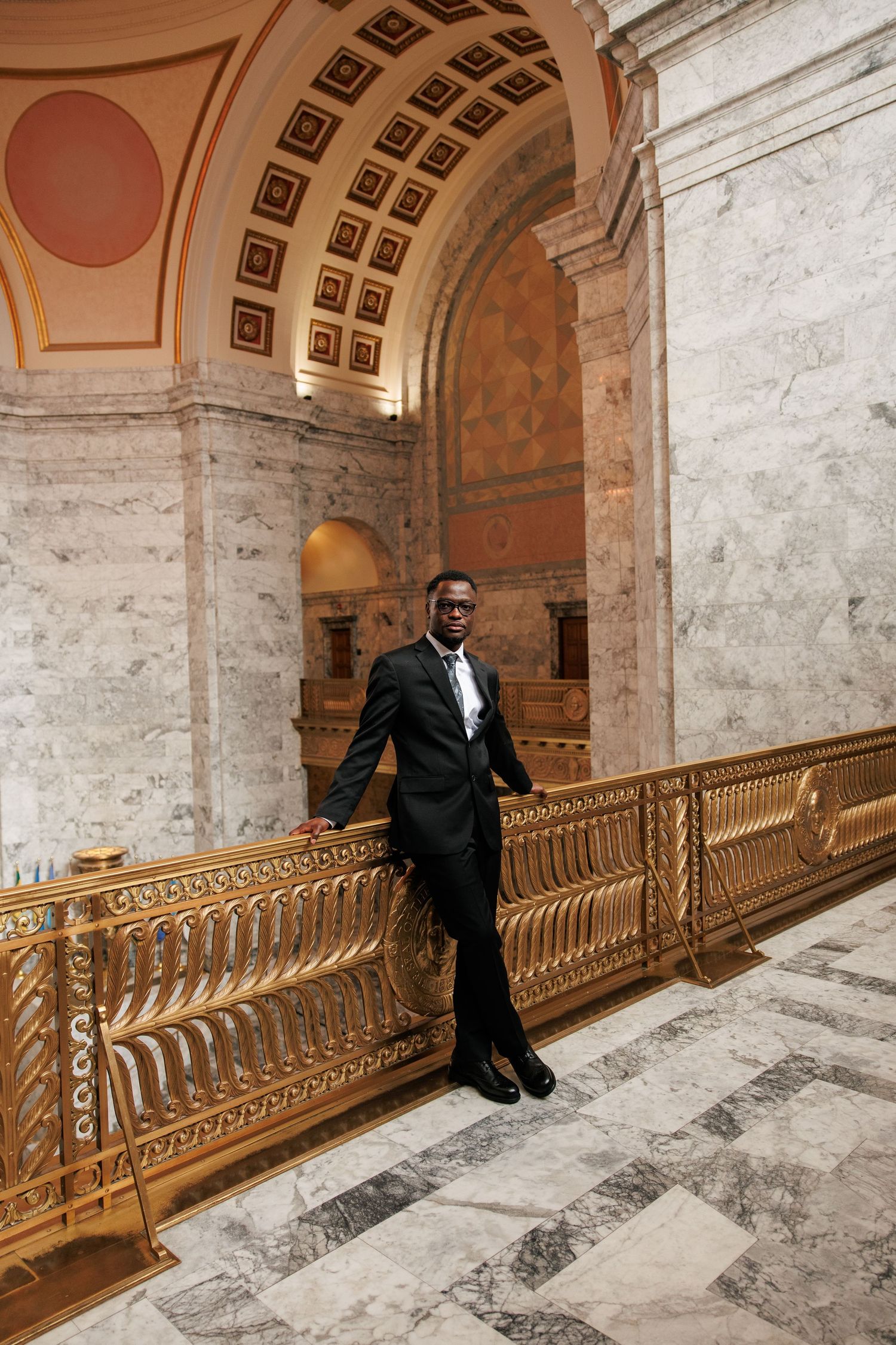 Groom portrait framed by the grand marble architecture of the Washington State Capitol in Olympia