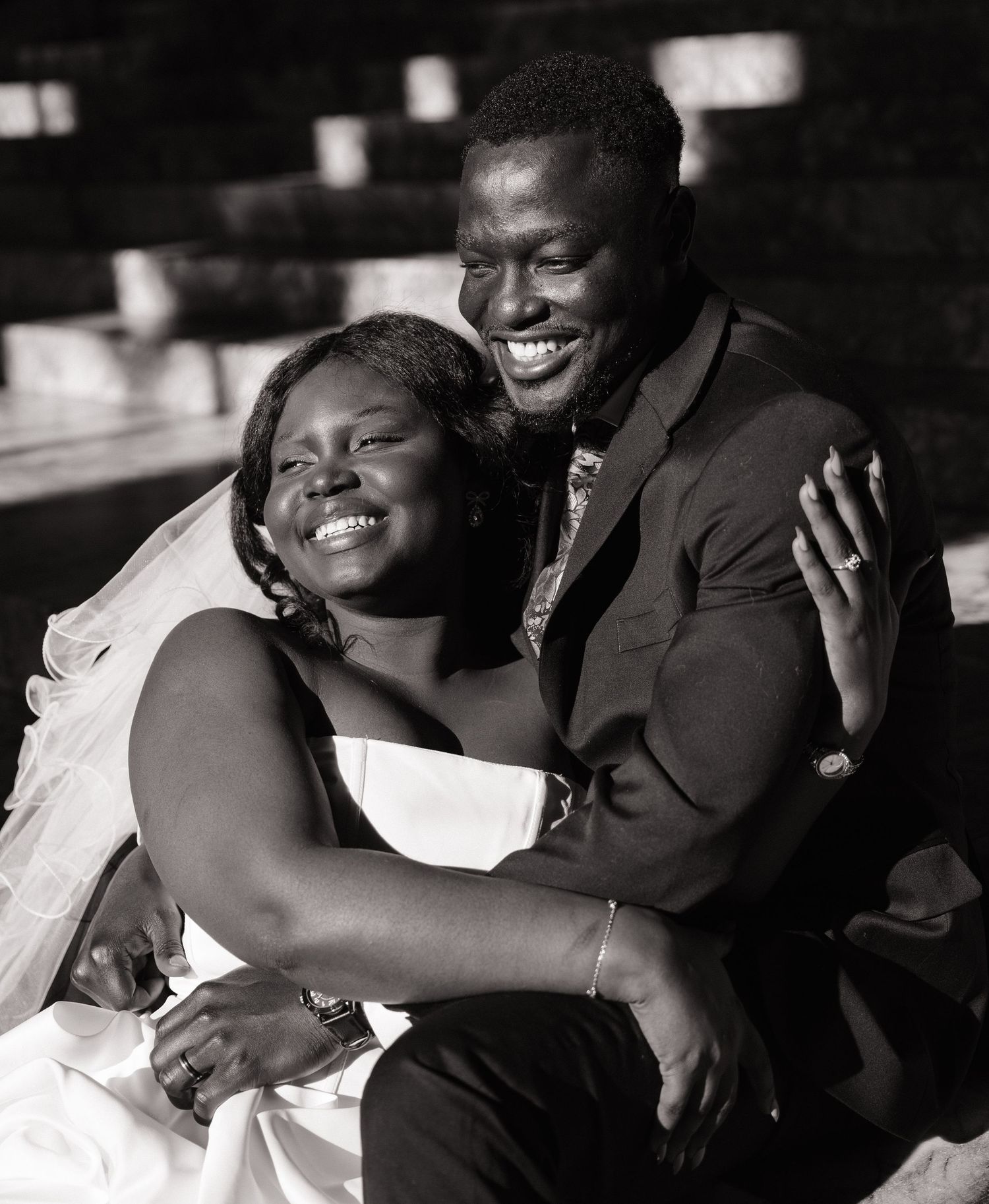 Candid black and white portrait of newlyweds laughing at the Washington State Capitol