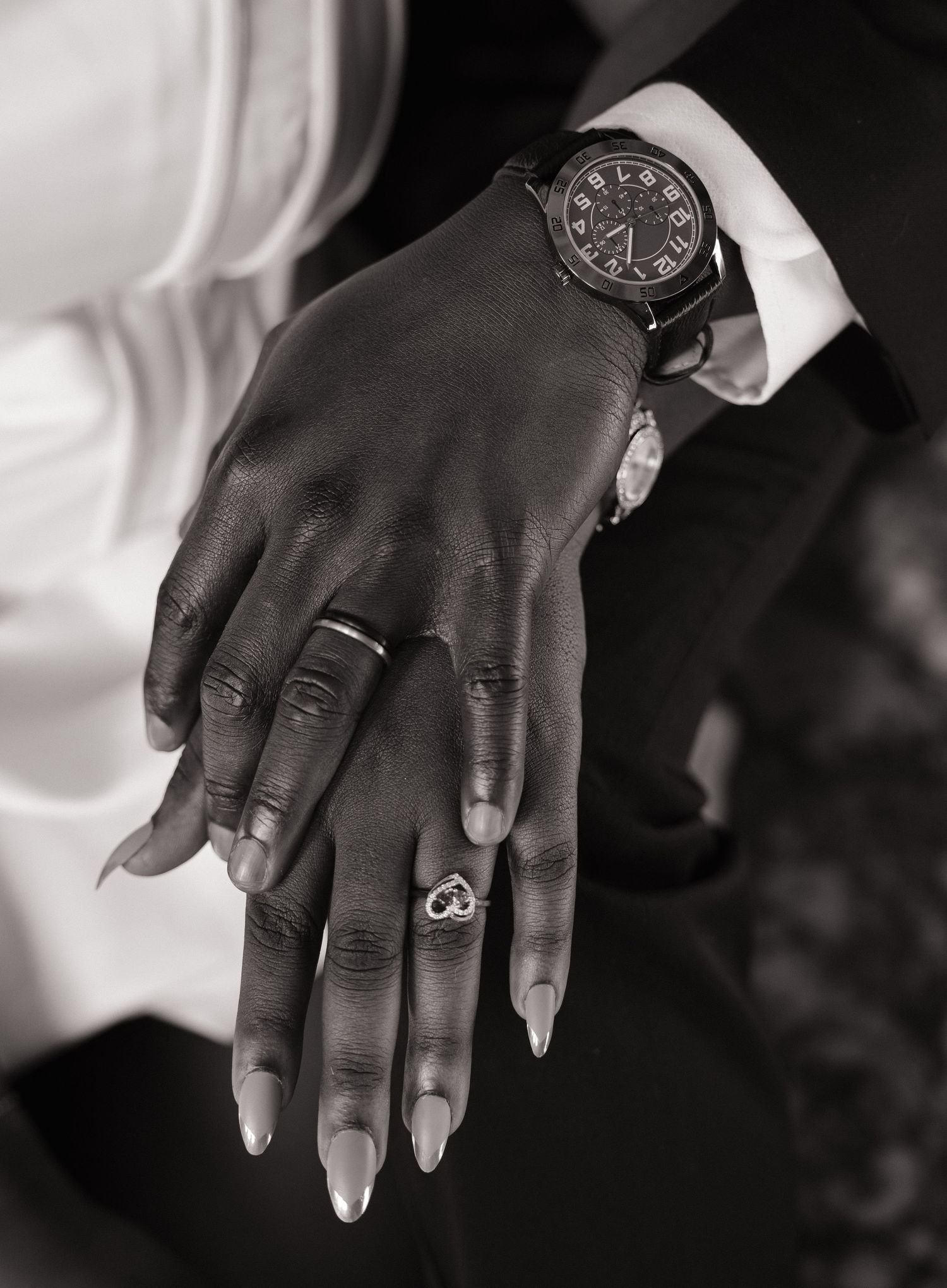 Close-up of the newlyweds’ wedding rings during their Olympia wedding