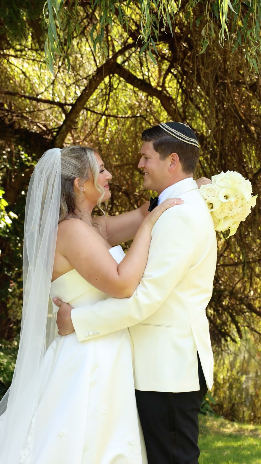 Bride and groom embracing outdoors during a romantic wedding portrait session in Washington.