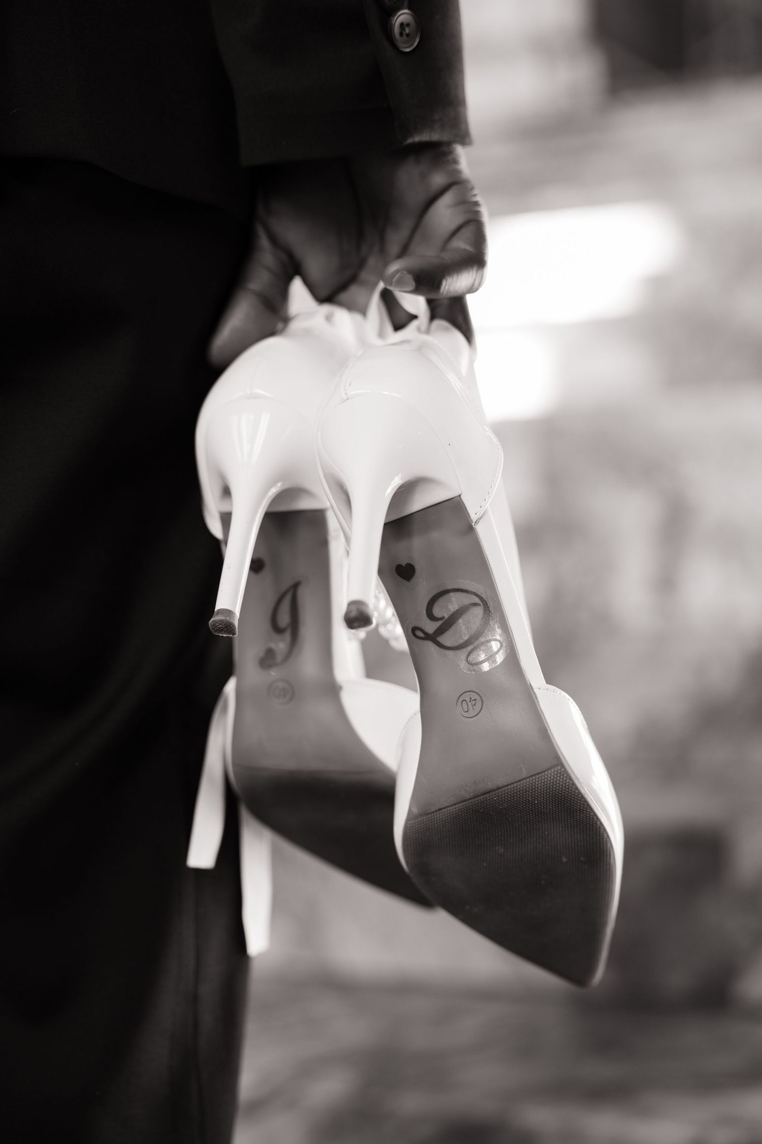 Black and white detail photo of the bride’s wedding shoes
