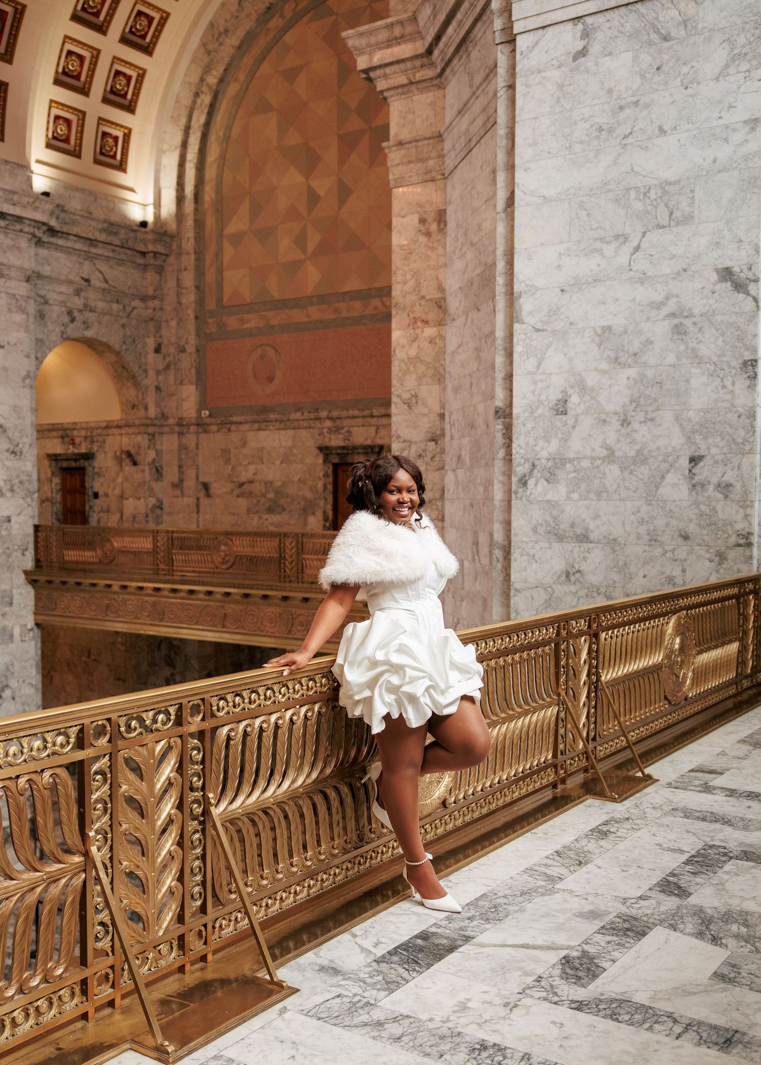 Bride posing beneath the grand architecture of the Washington State Capitol in Olympia