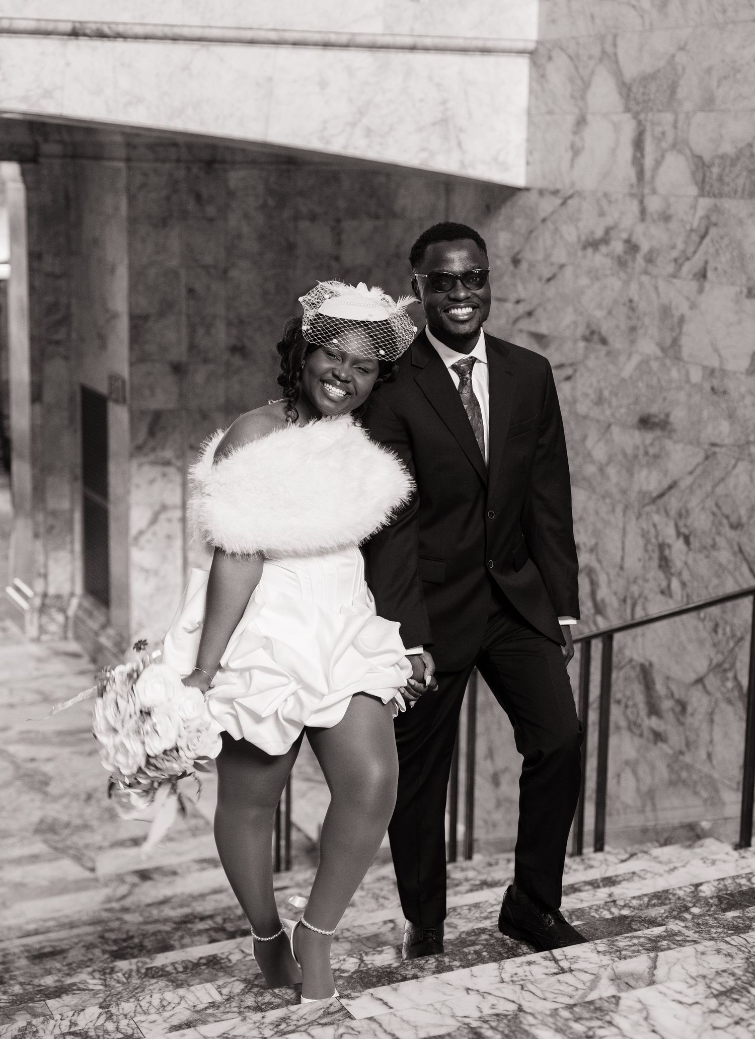 Bride and groom smiling together on the Washington State Capitol stairs