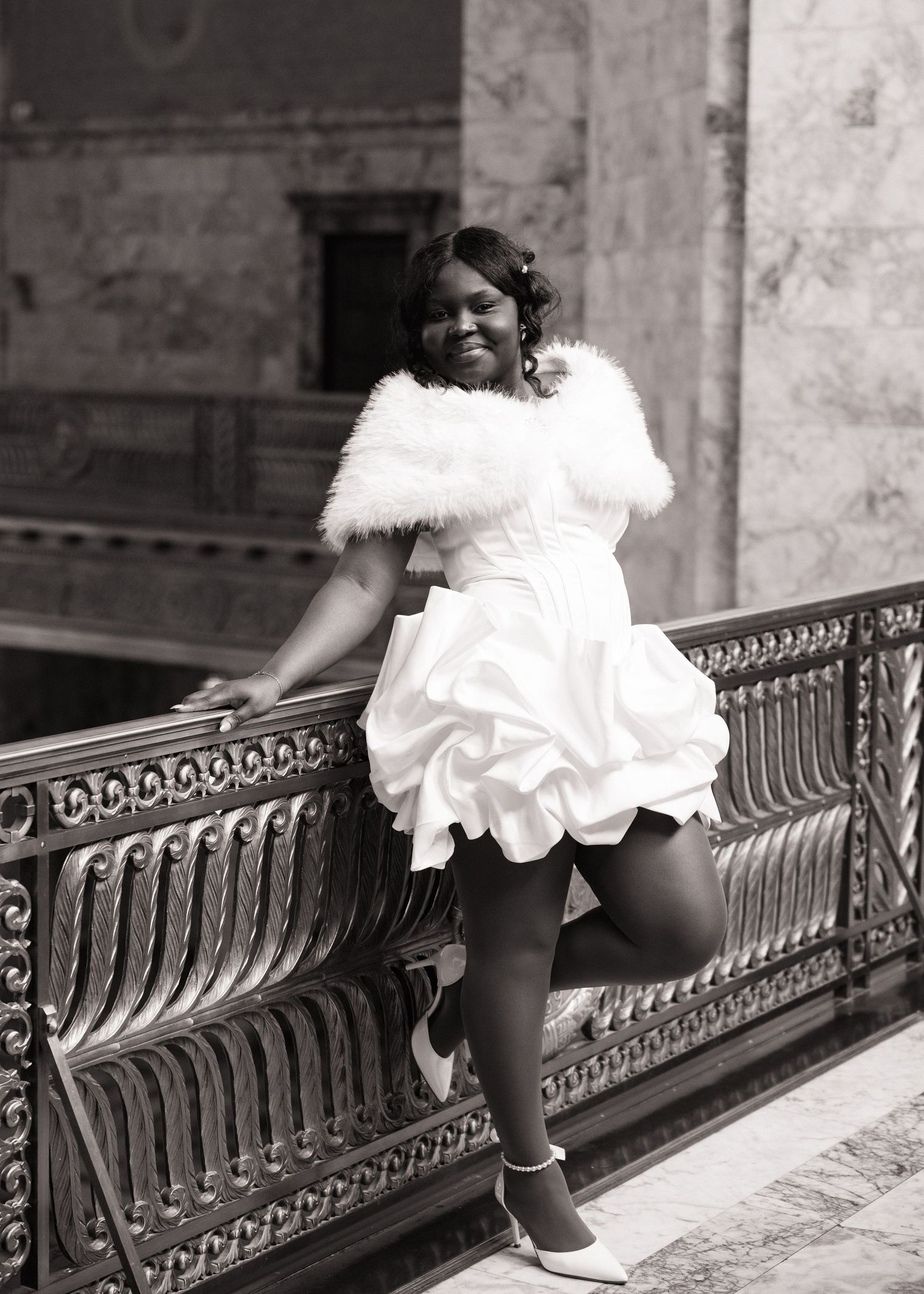 Bride posing by the ornate railing inside the Washington State Capitol in Olympia