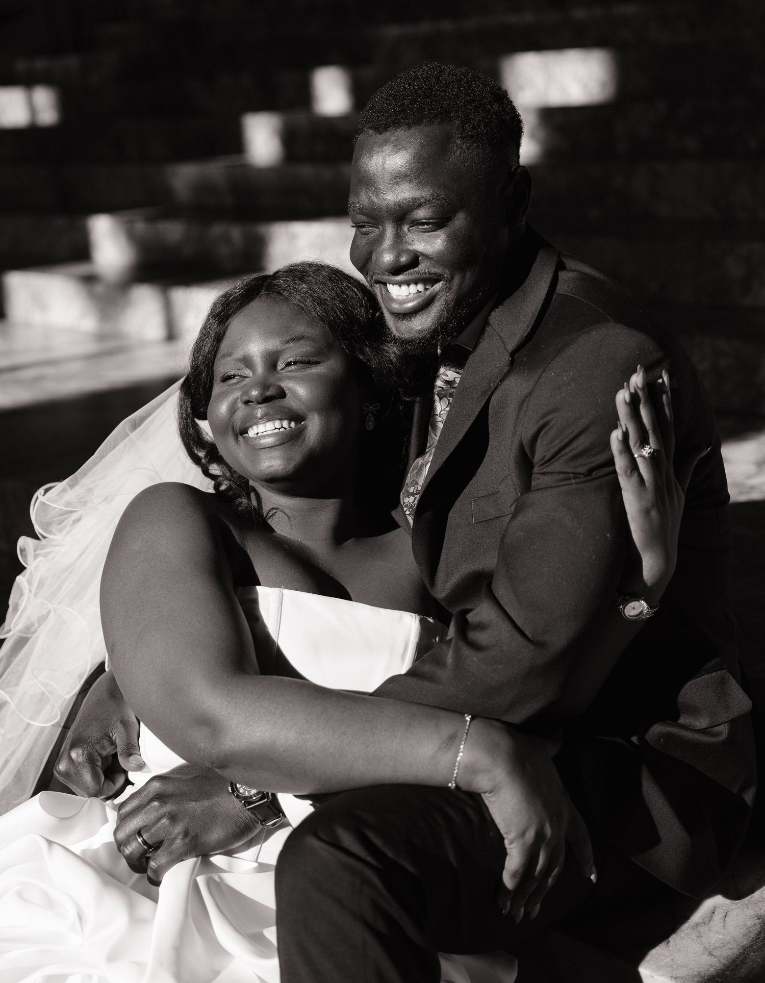 Candid black and white portrait of newlyweds laughing together at their Olympia wedding