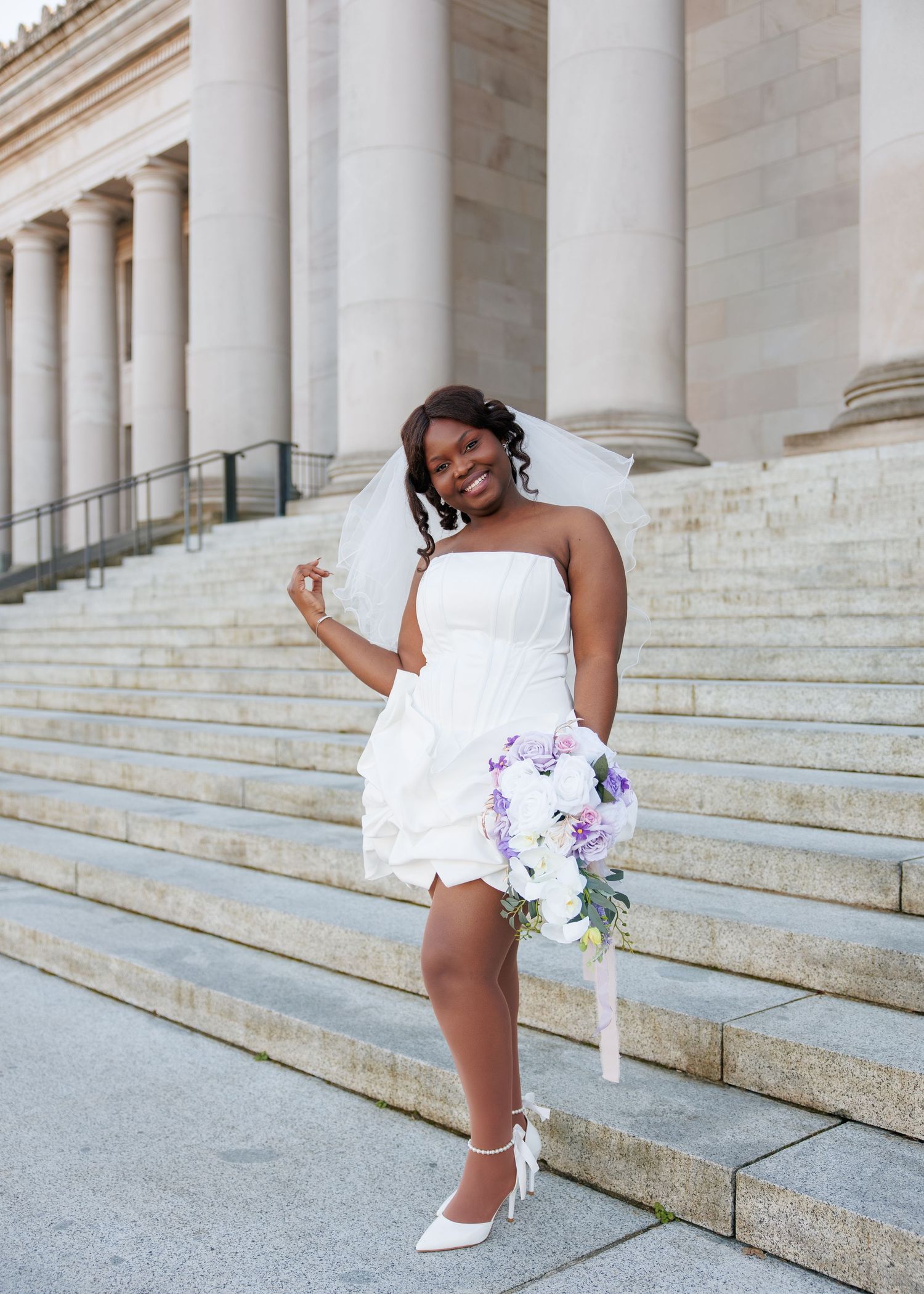 Candid bridal portrait with bouquet outside the Washington State Capitol in Olympia