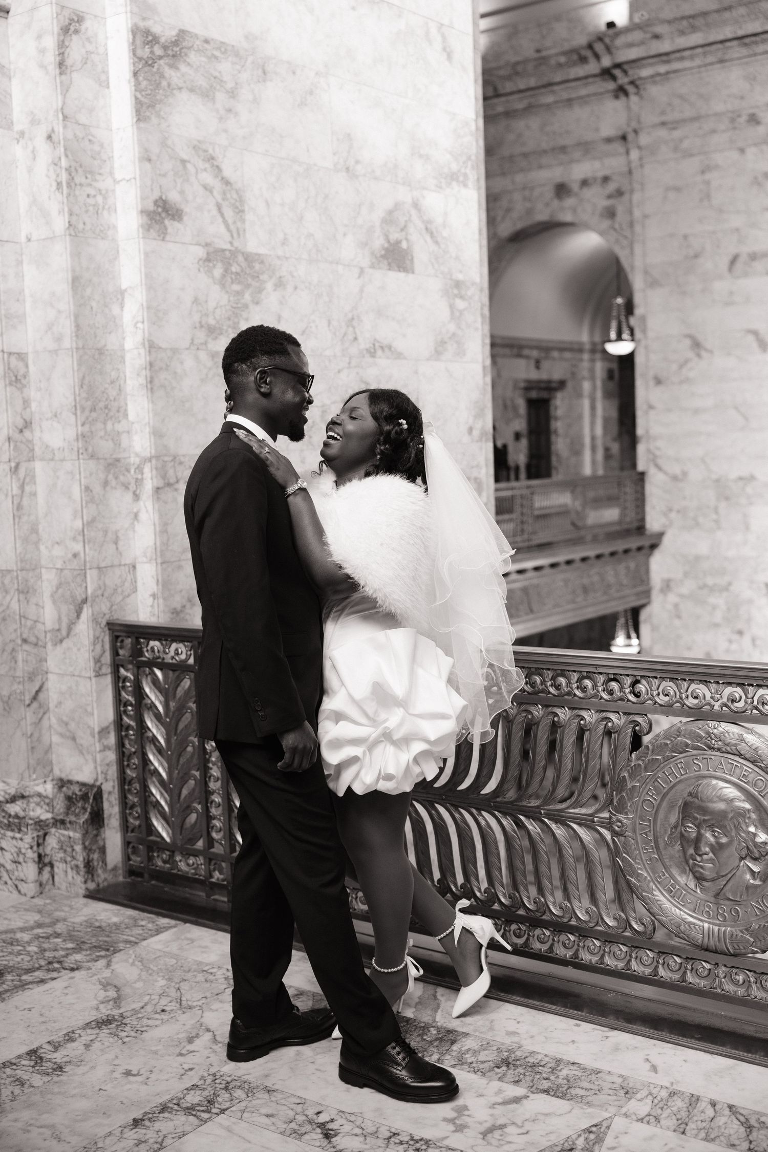 Bride and groom sharing a kiss inside the Washington State Capitol in Olympia