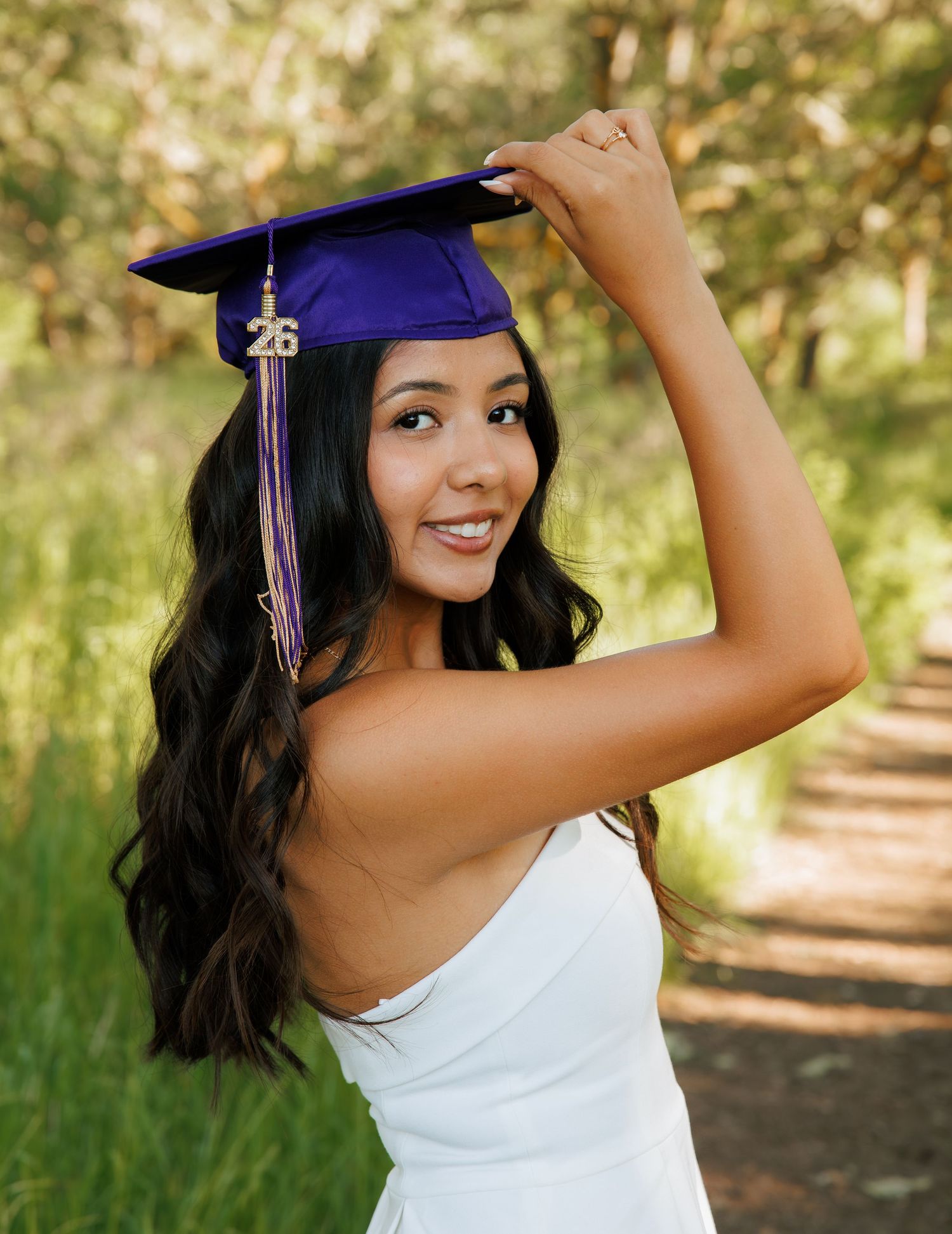 High school senior wearing her graduation cap during an outdoor senior portrait session in Washington.