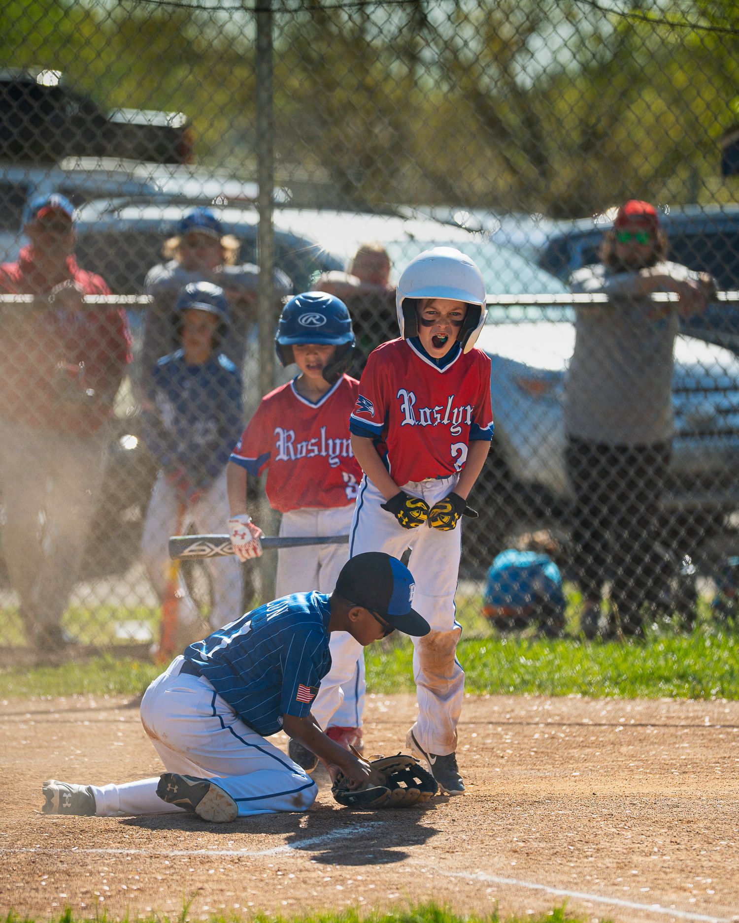Baseball player celebrating homerun.