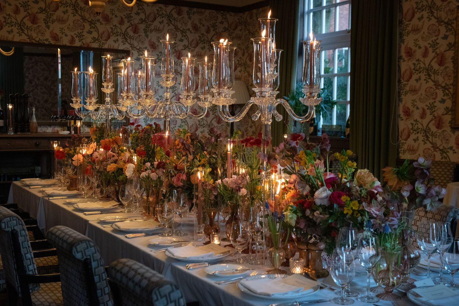 Elegant wedding reception table adorned with crystal candelabras and colorful floral centerpieces.  Four Seasons Hotel, Hampshire.
