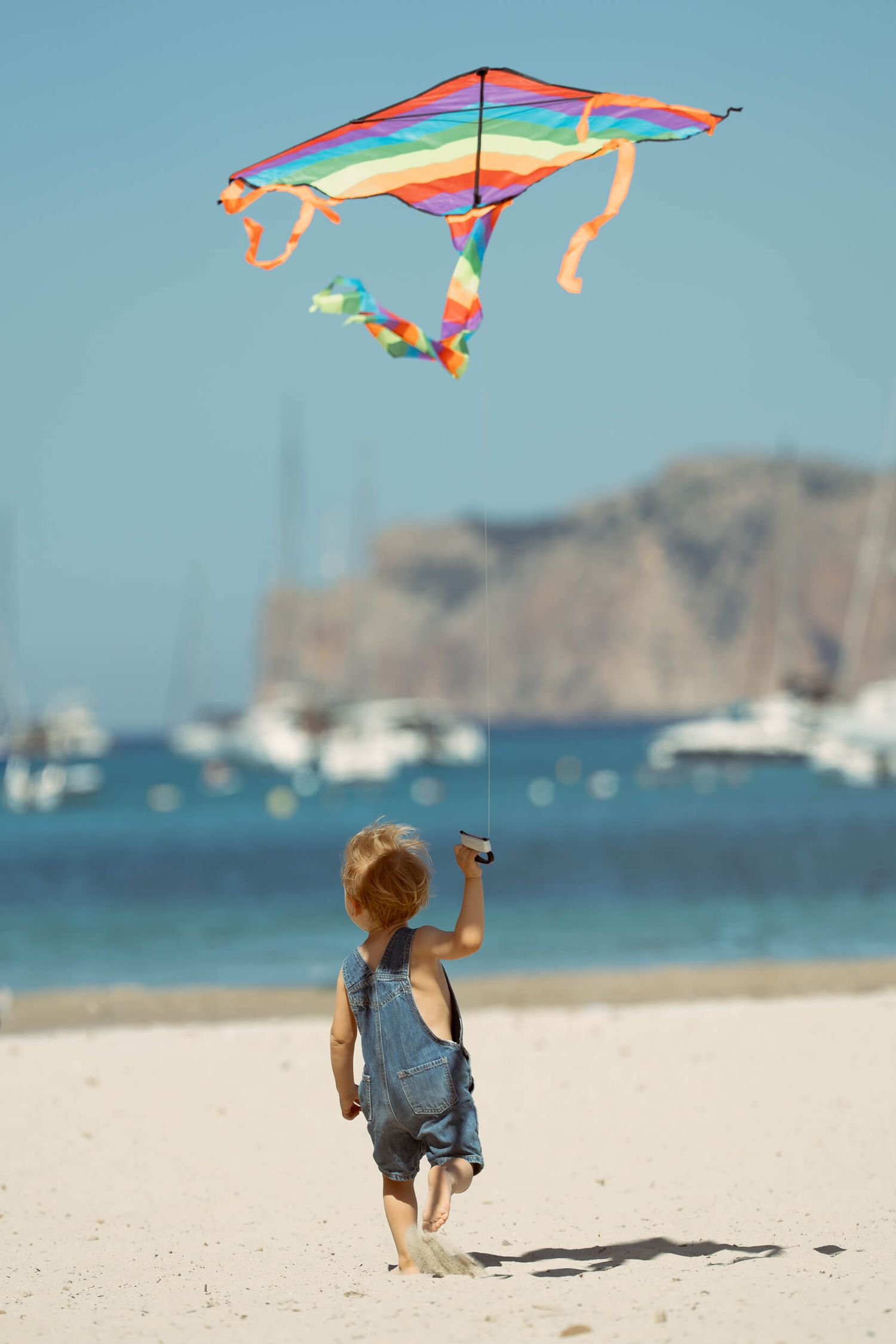 Family portraits by the water Mallorca, cinematic photography, Sofi Ammann, zurich switzerland family photography
