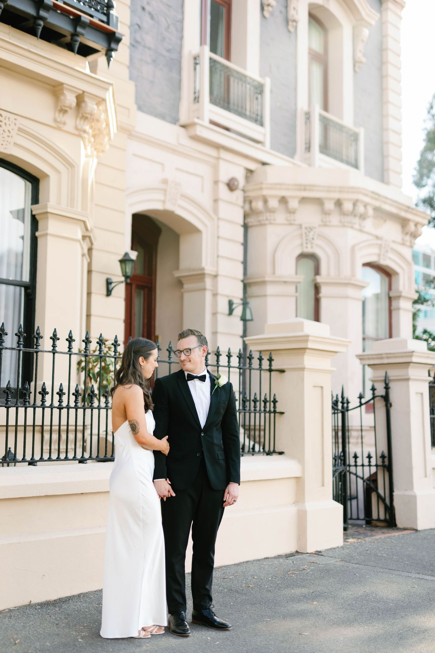 Brooke and Lloyd standing beside an ornate heritage building on North Terrace